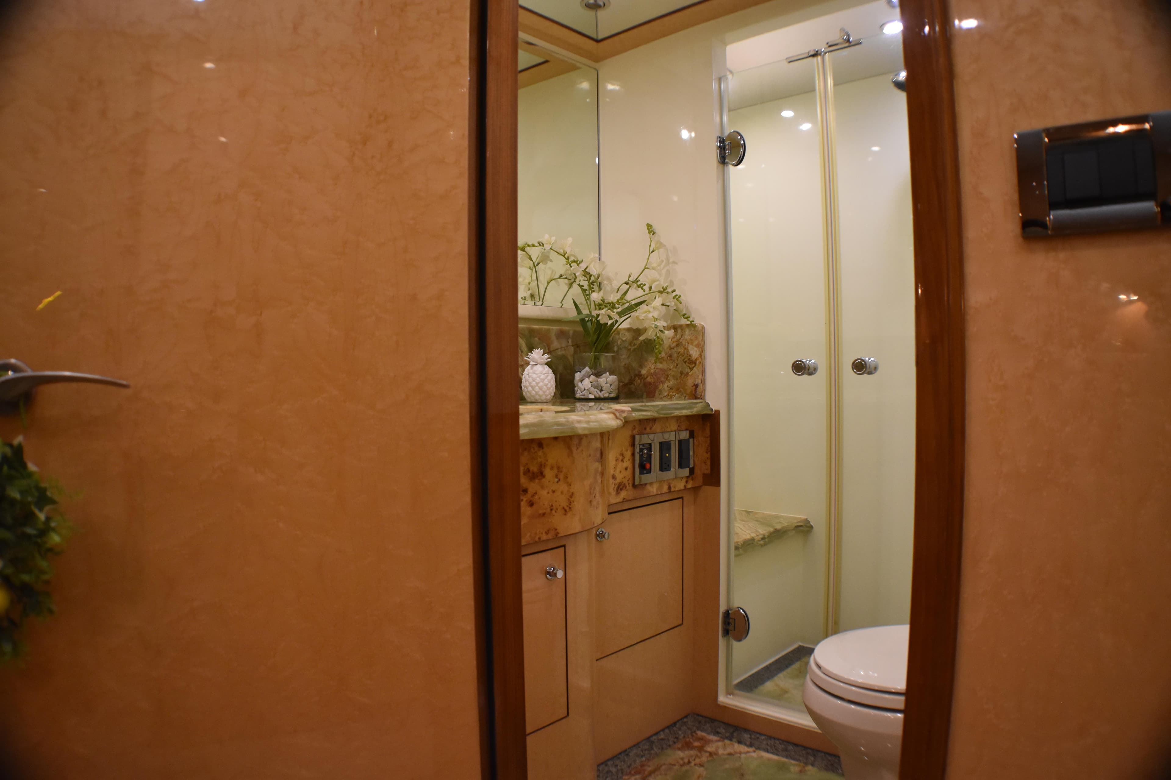 Luxurious bathroom in 2006 Johnson Country Kitchen yacht, featuring elegant marble and modern fixtures.