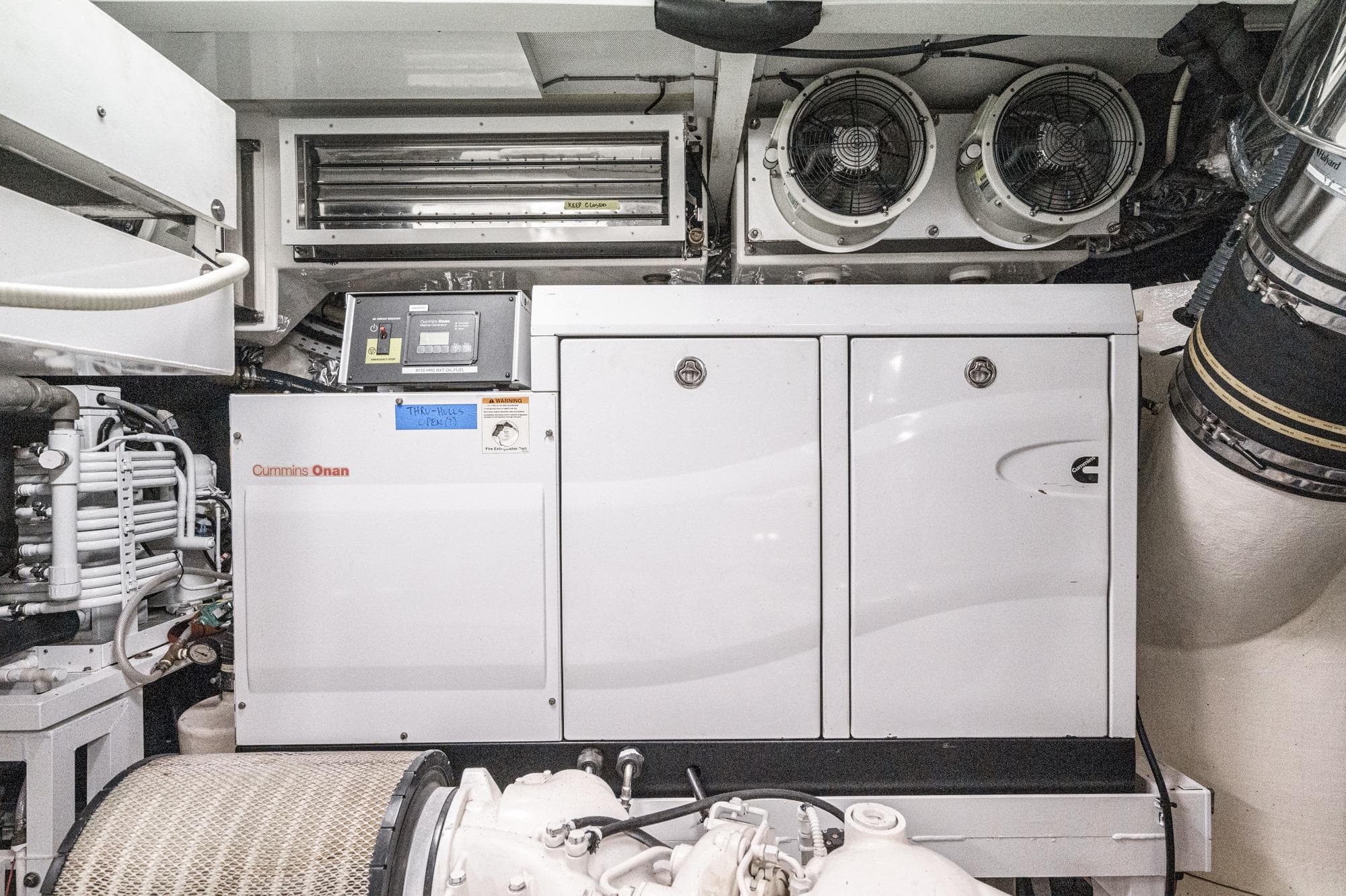 Engine room of 2011 Princess 95 Motor Yacht with Cummins Onan generator.