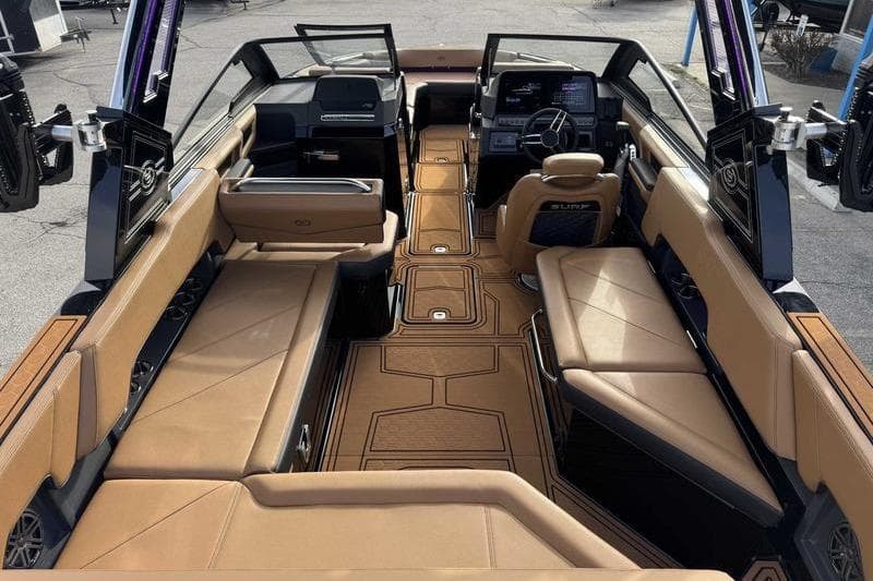 2026 Cobalt R8 Surf boat interior with luxurious tan seating and modern dashboard.