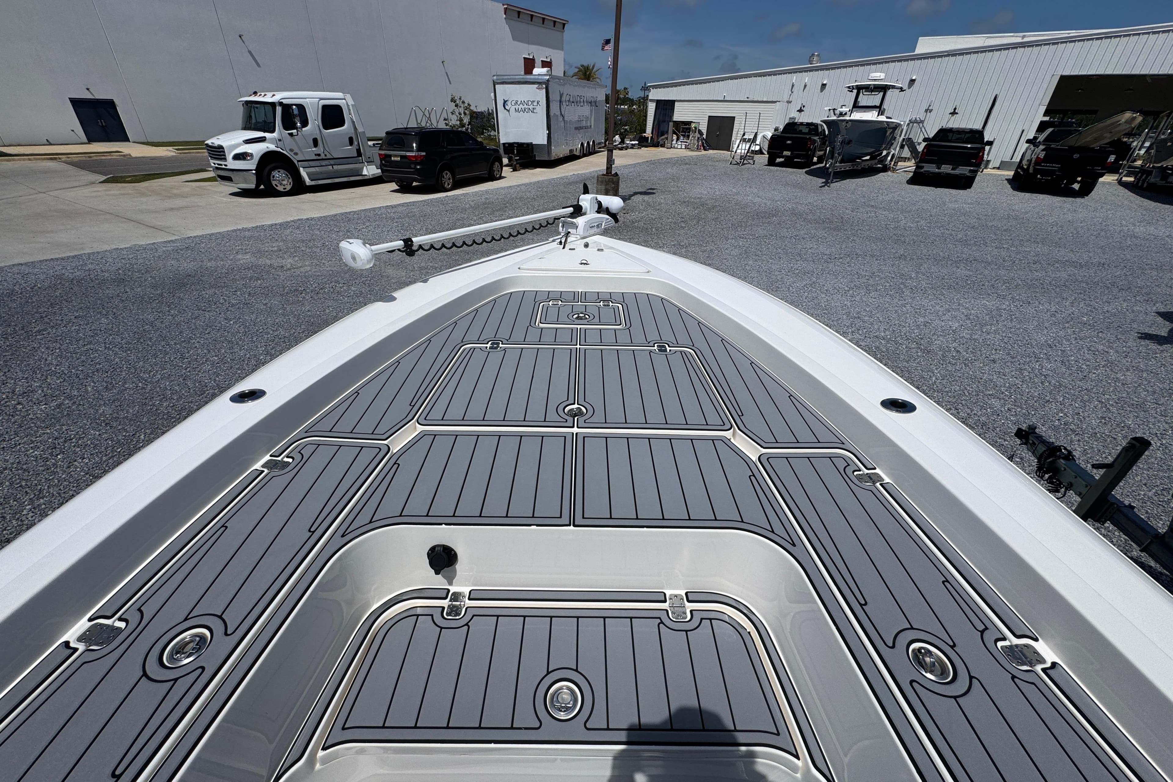 Bow view of 2019 ShearWater 270 Carolina Flare boat at a marina.