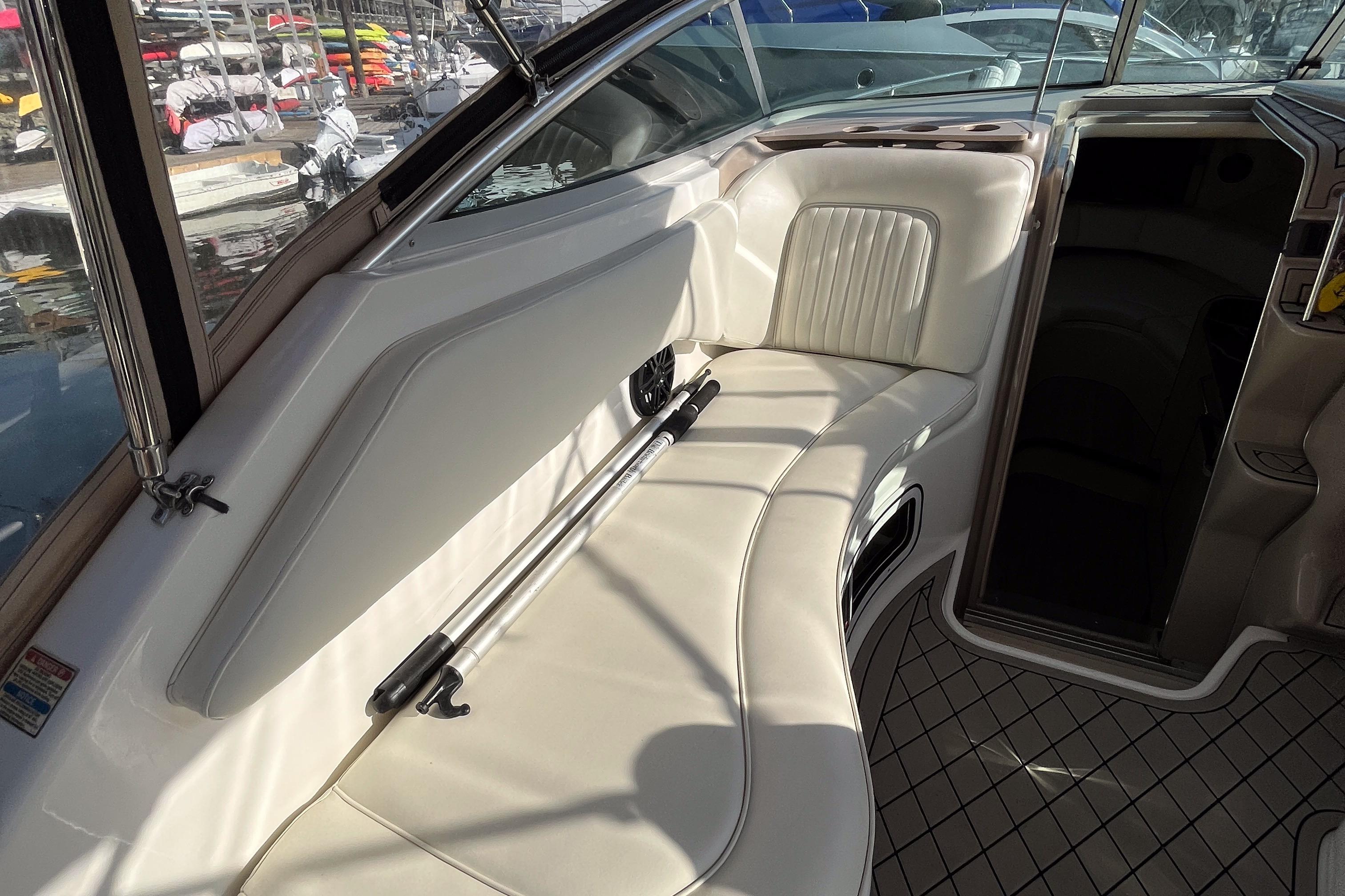 2001 Sea Ray 270 Sundancer interior with white leather seating and modern design.