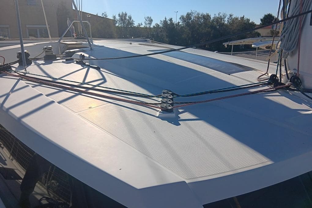 Deck of 2017 Fountaine Pajot Lucia 40 catamaran with rigging and ropes.