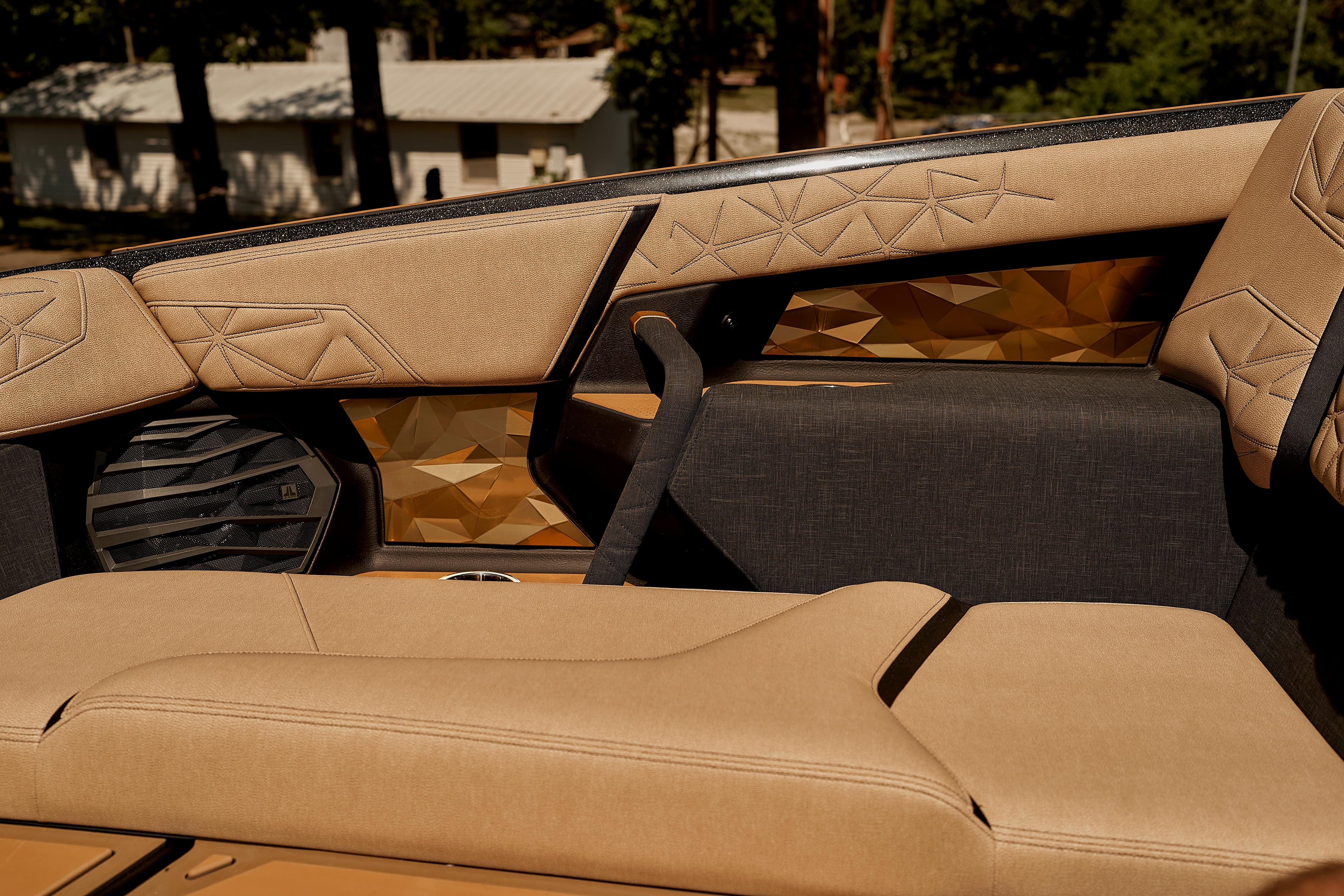 2025 Nautique Super Air Nautique G25 Paragon interior with luxurious tan seating and geometric accents.