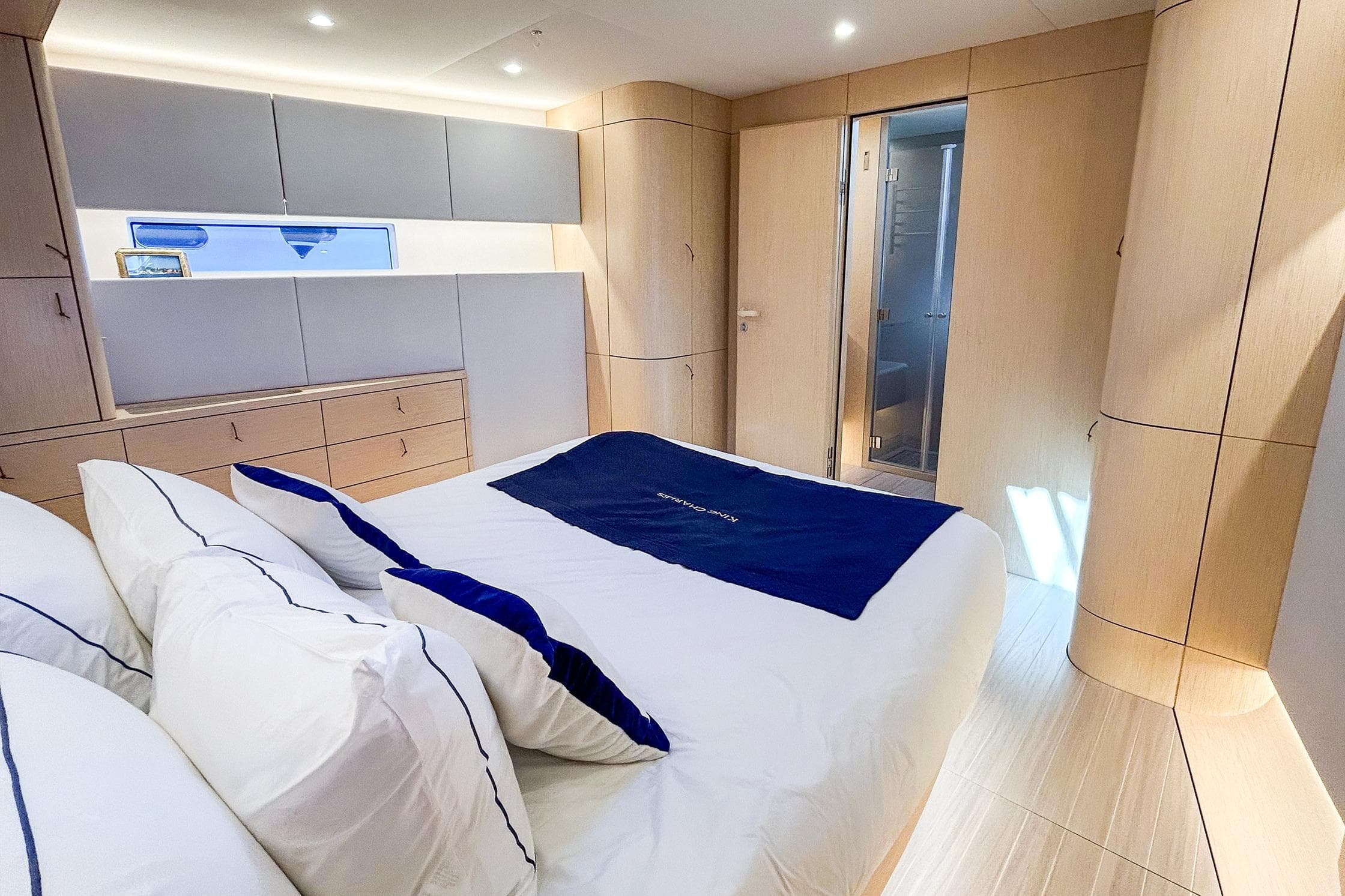 Luxurious 2024 YYachts Y8 bedroom with modern design and elegant wood finishes.