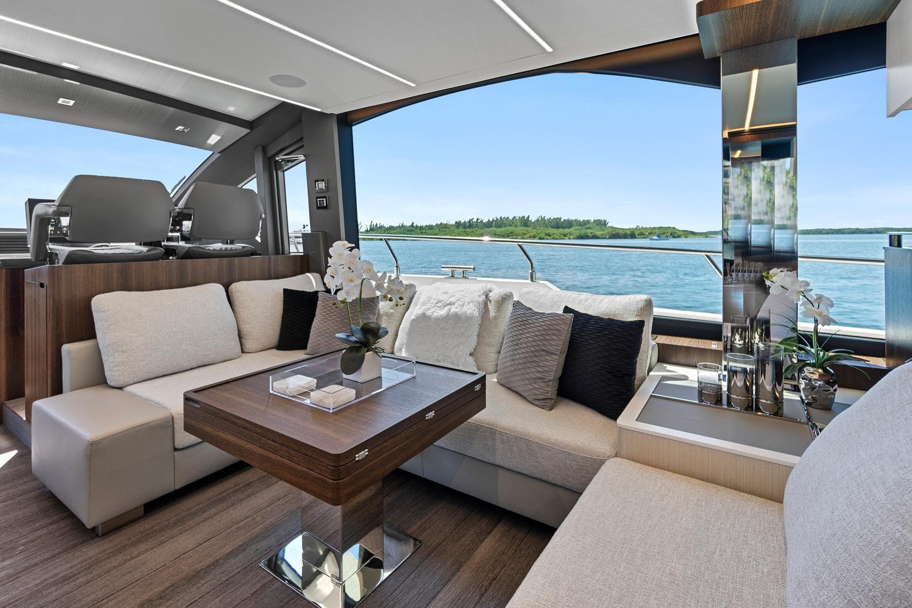 Luxurious interior of 2023 Astondoa 66 Flybridge yacht with elegant seating and scenic ocean view.
