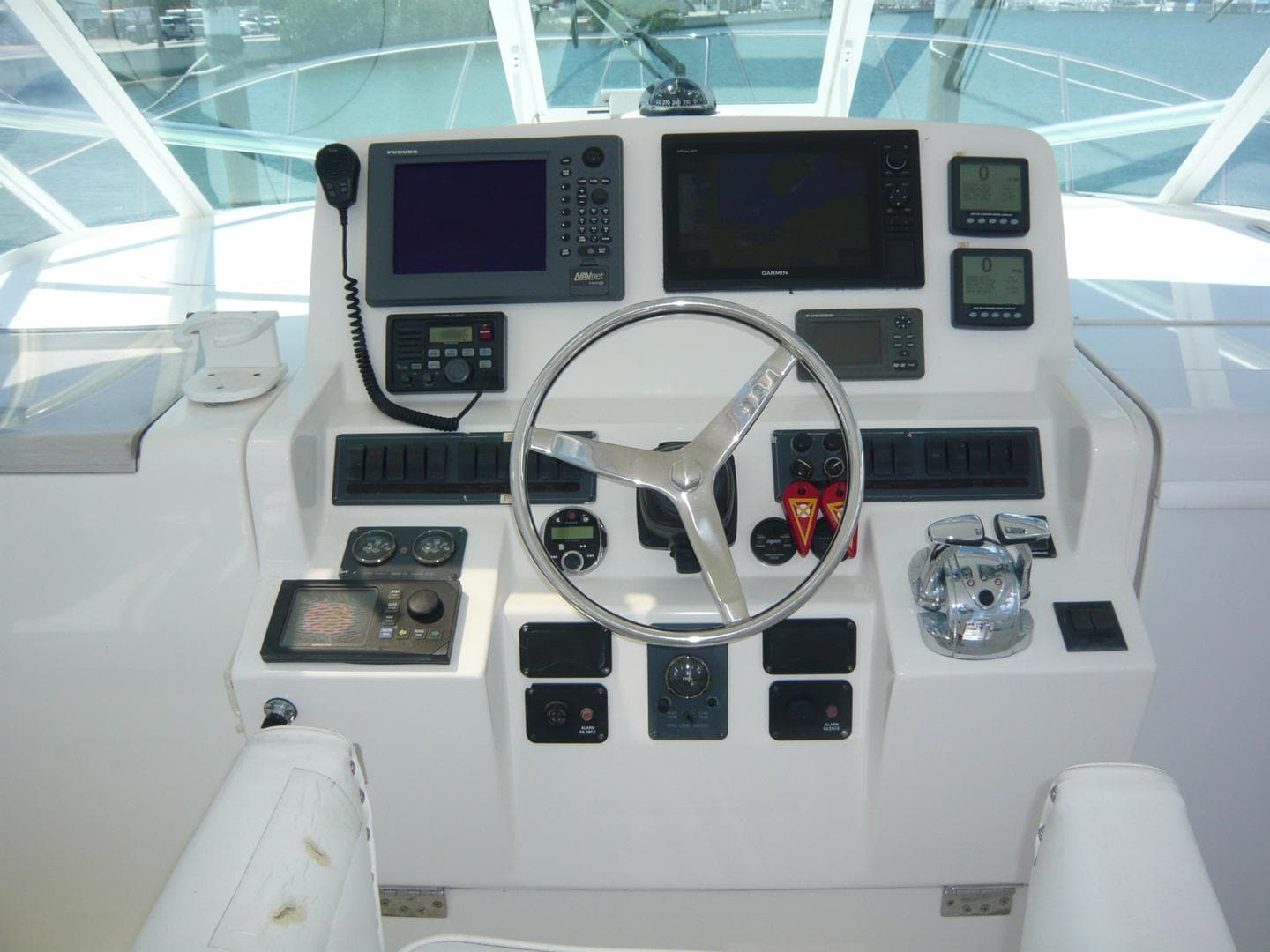 Control panel of 2004 Rampage 38 Express boat with navigation and communication equipment.