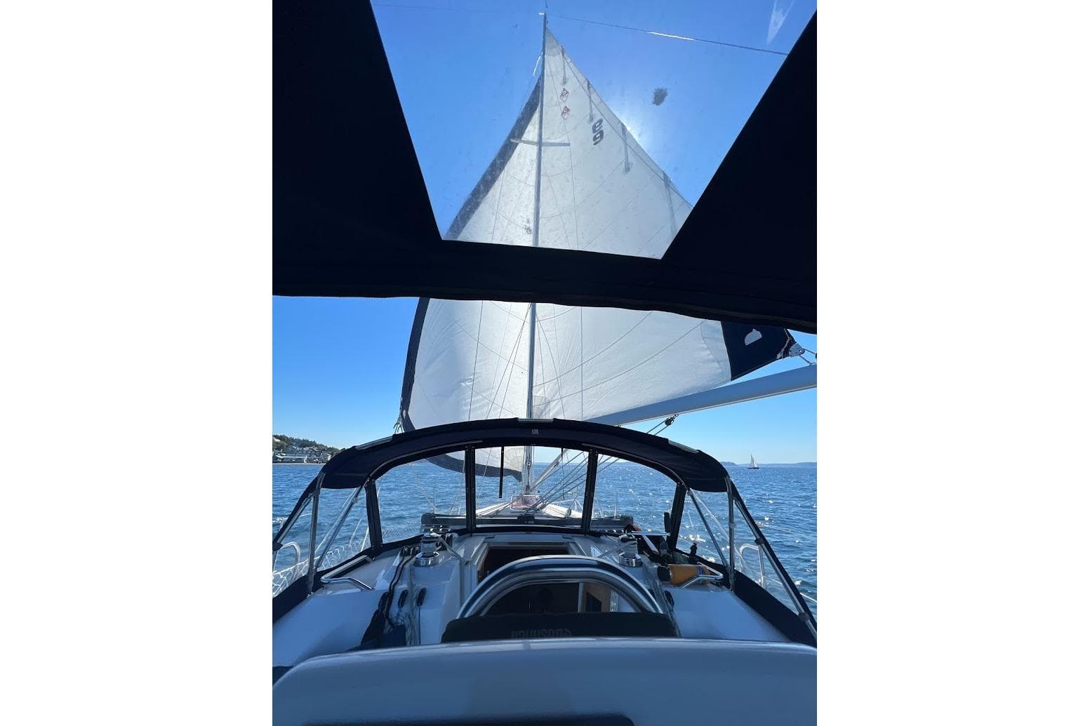 Sailing on a 2012 Catalina 355 yacht with open sails on a sunny day.