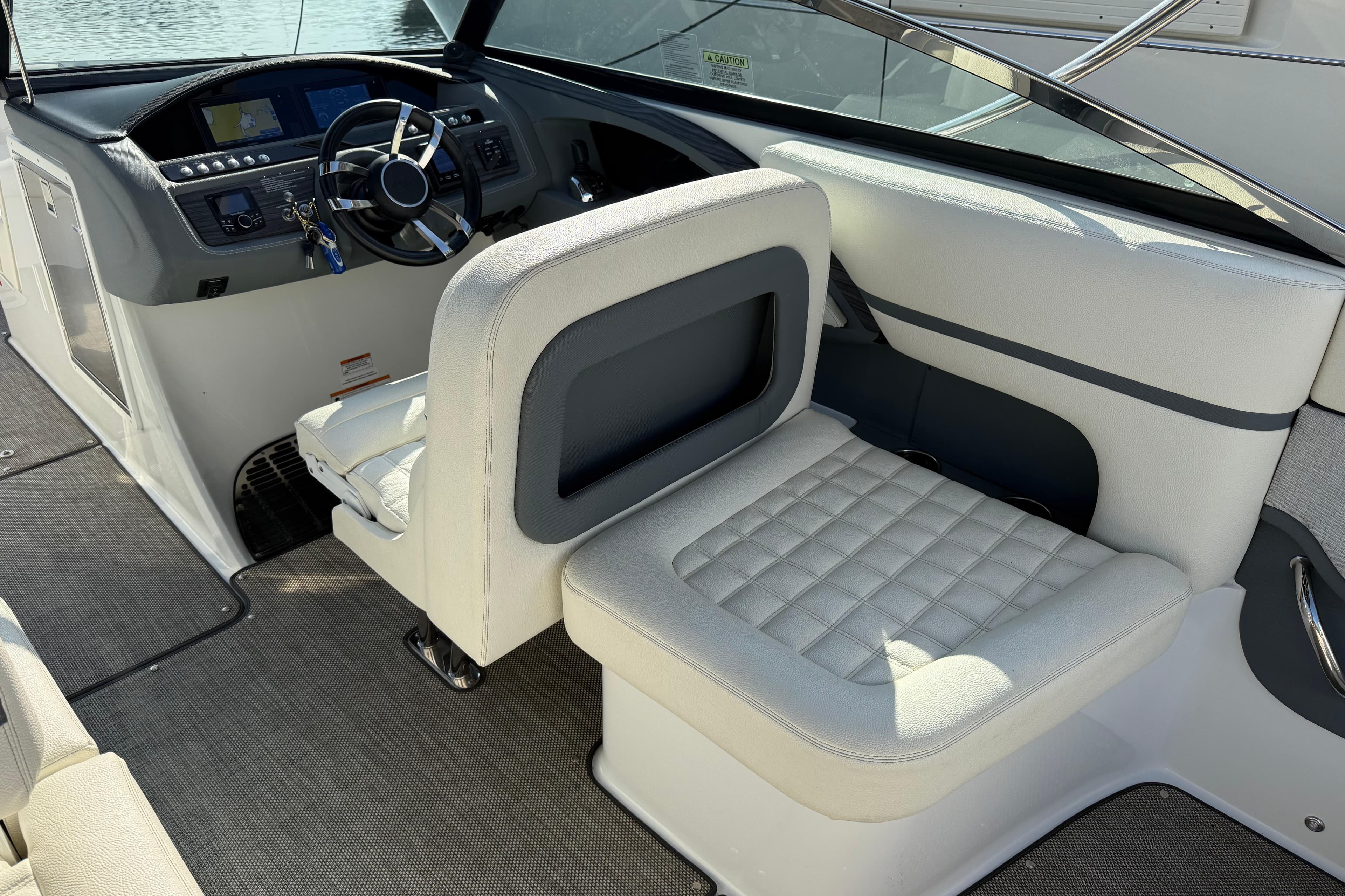 Interior of a 2017 Cobalt R30 boat featuring a modern helm and seating area.