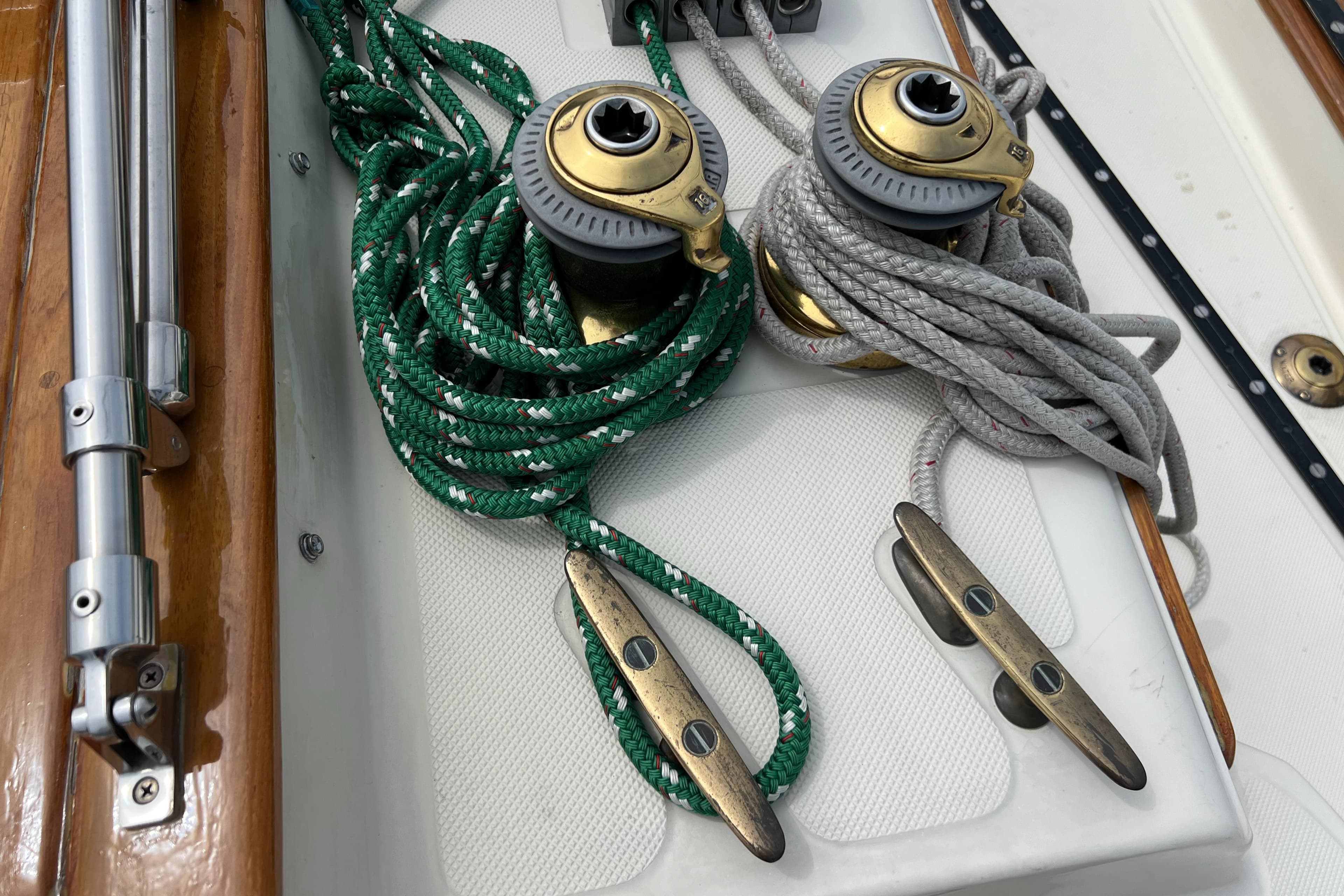 Winches and cleats on a 1994 Pacific Seacraft 34 sailboat deck.