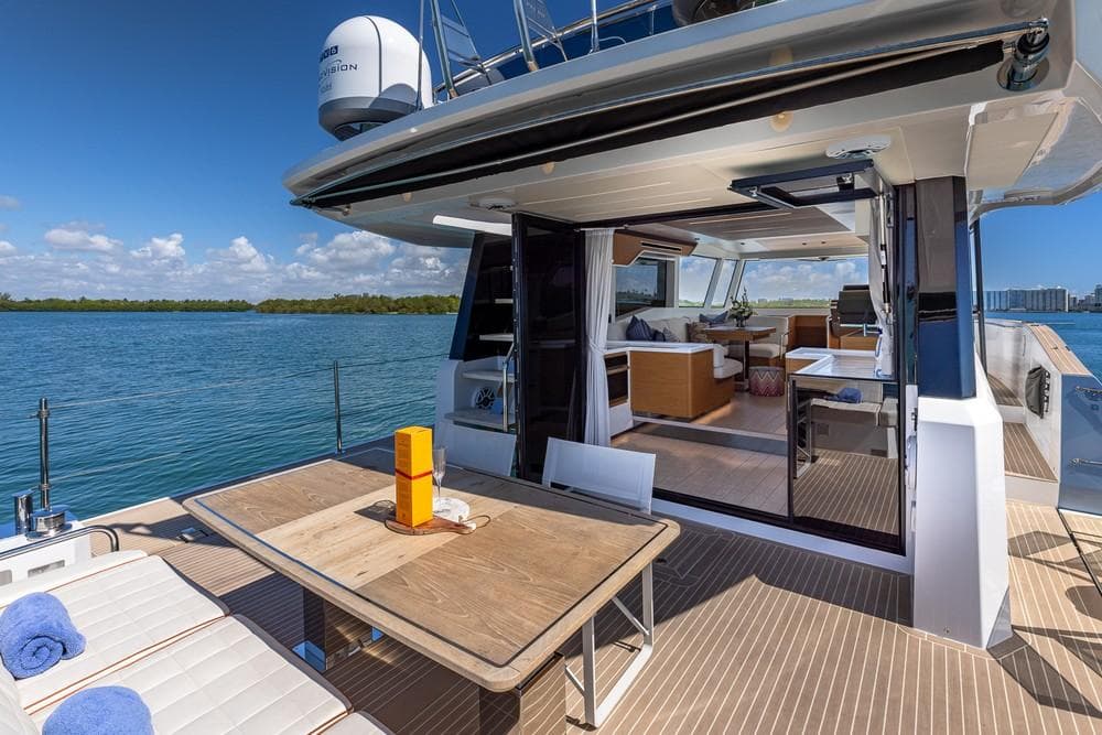 2024 Pardo Yachts E60 luxury yacht with open deck, dining area, and scenic ocean view.