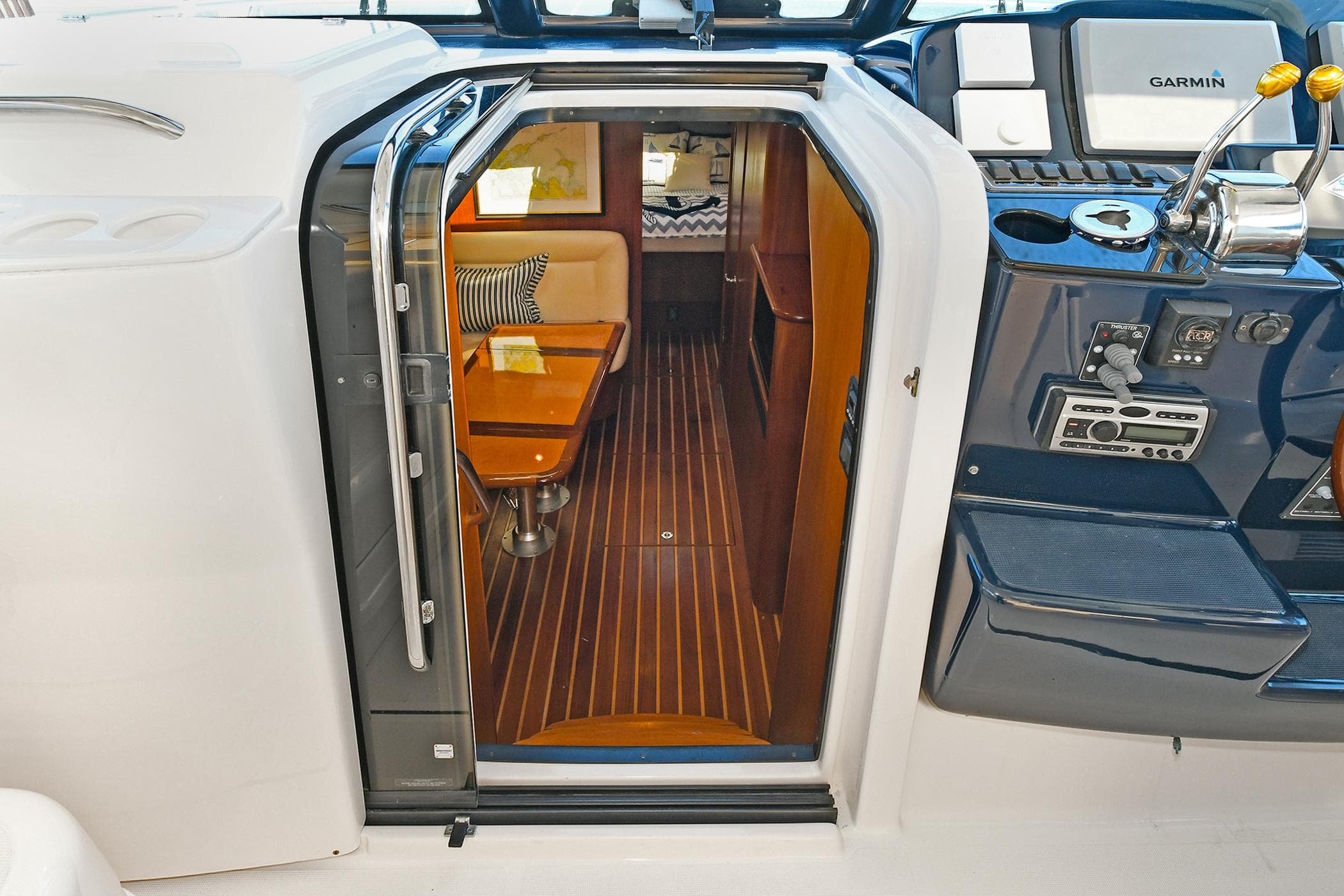 2008 Tiara Yachts 4200 Open interior with wood flooring and seating area.