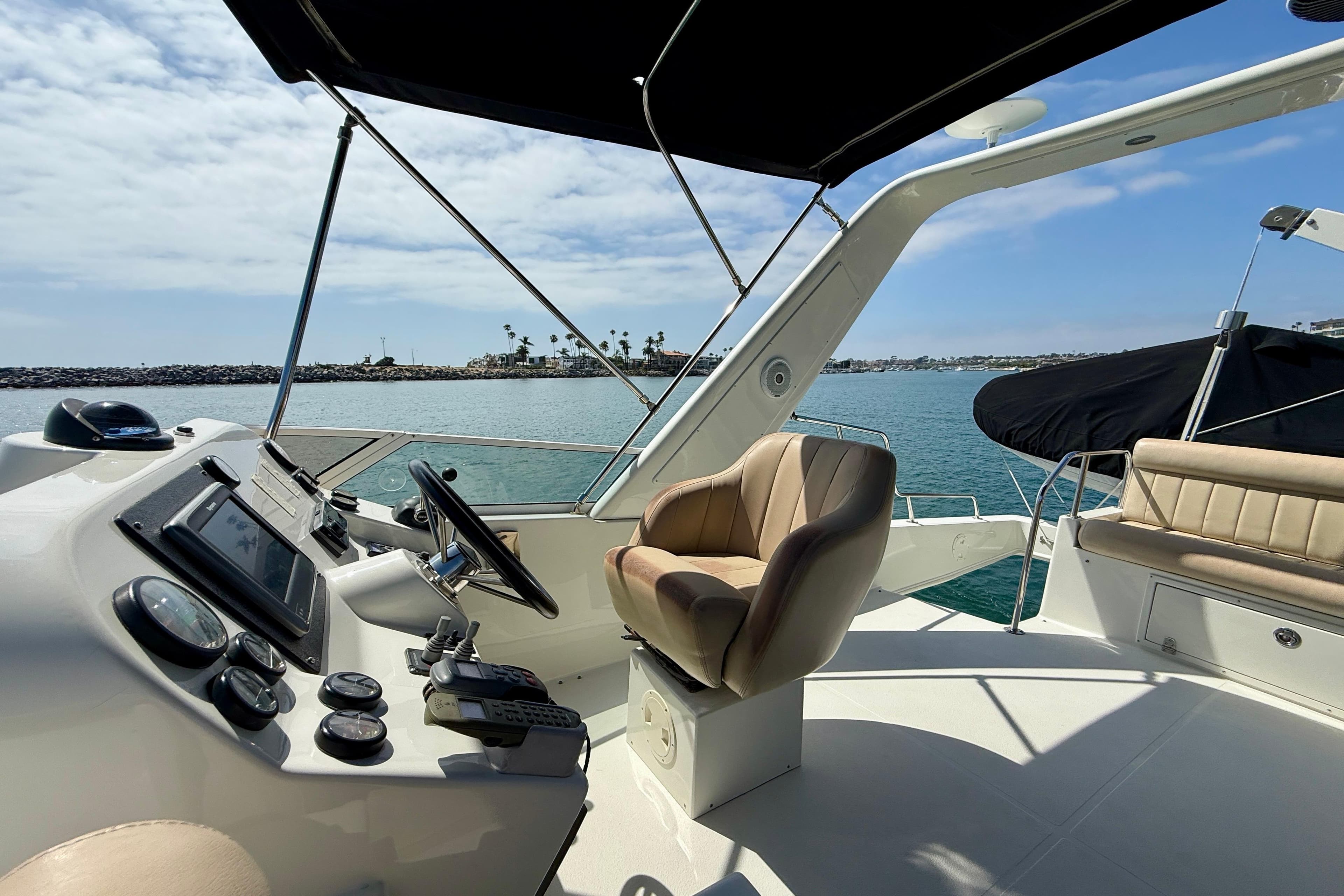 Cockpit view of 2007 Navigator 44 Classic yacht with ocean backdrop.