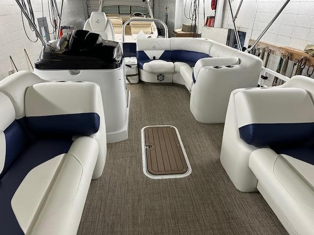 2024 JC Spirit 221 TT Sport boat interior with white and blue seating.