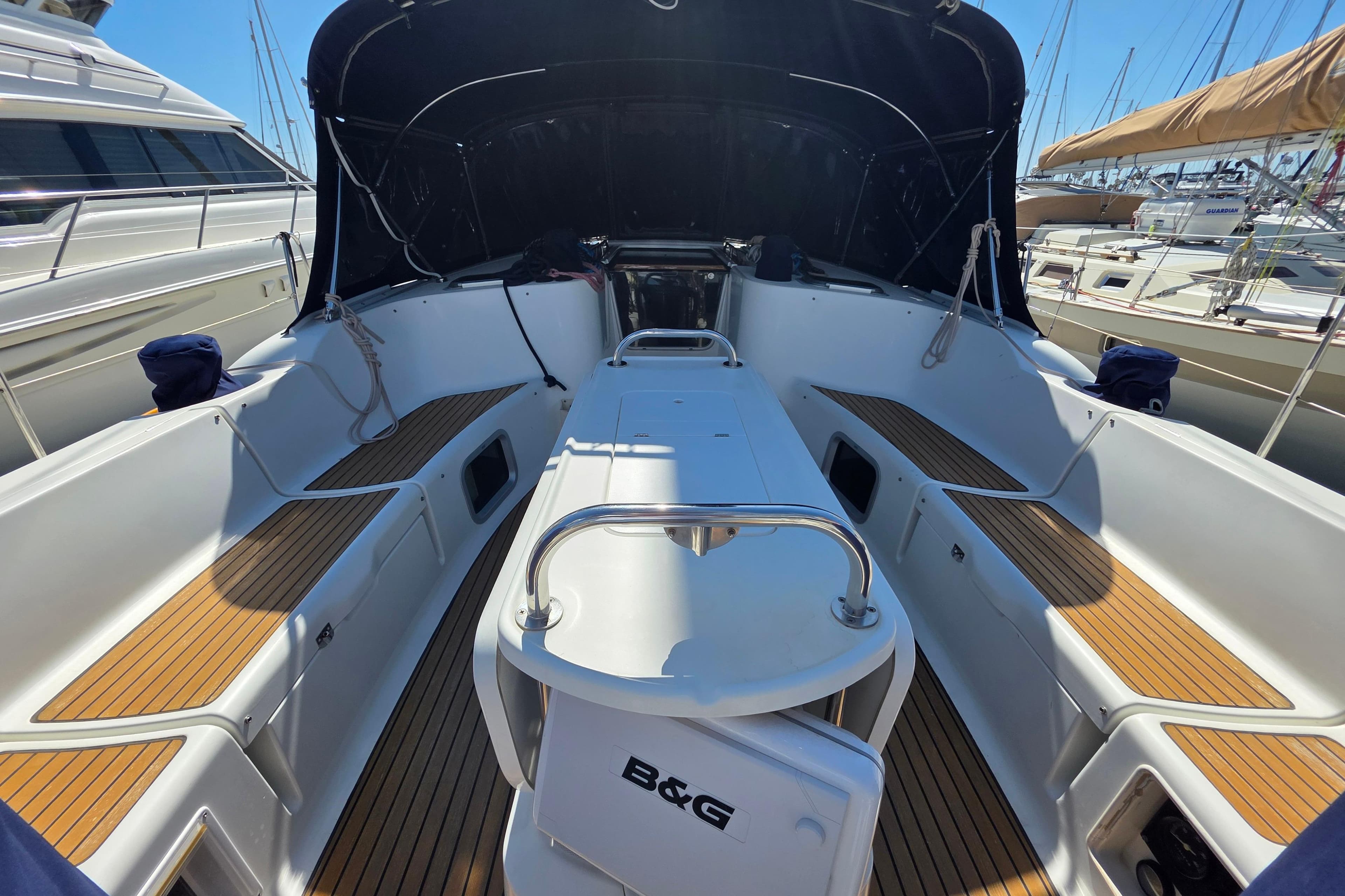 2007 Jeanneau 49 Performance yacht cockpit with teak flooring and covered seating area.