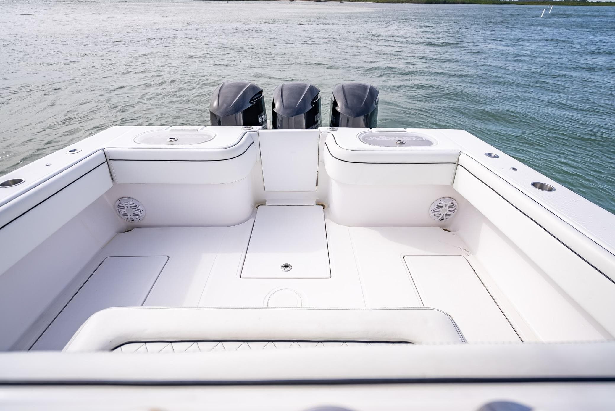2020 SeaHunter 35 Tournament boat stern with triple outboard motors.