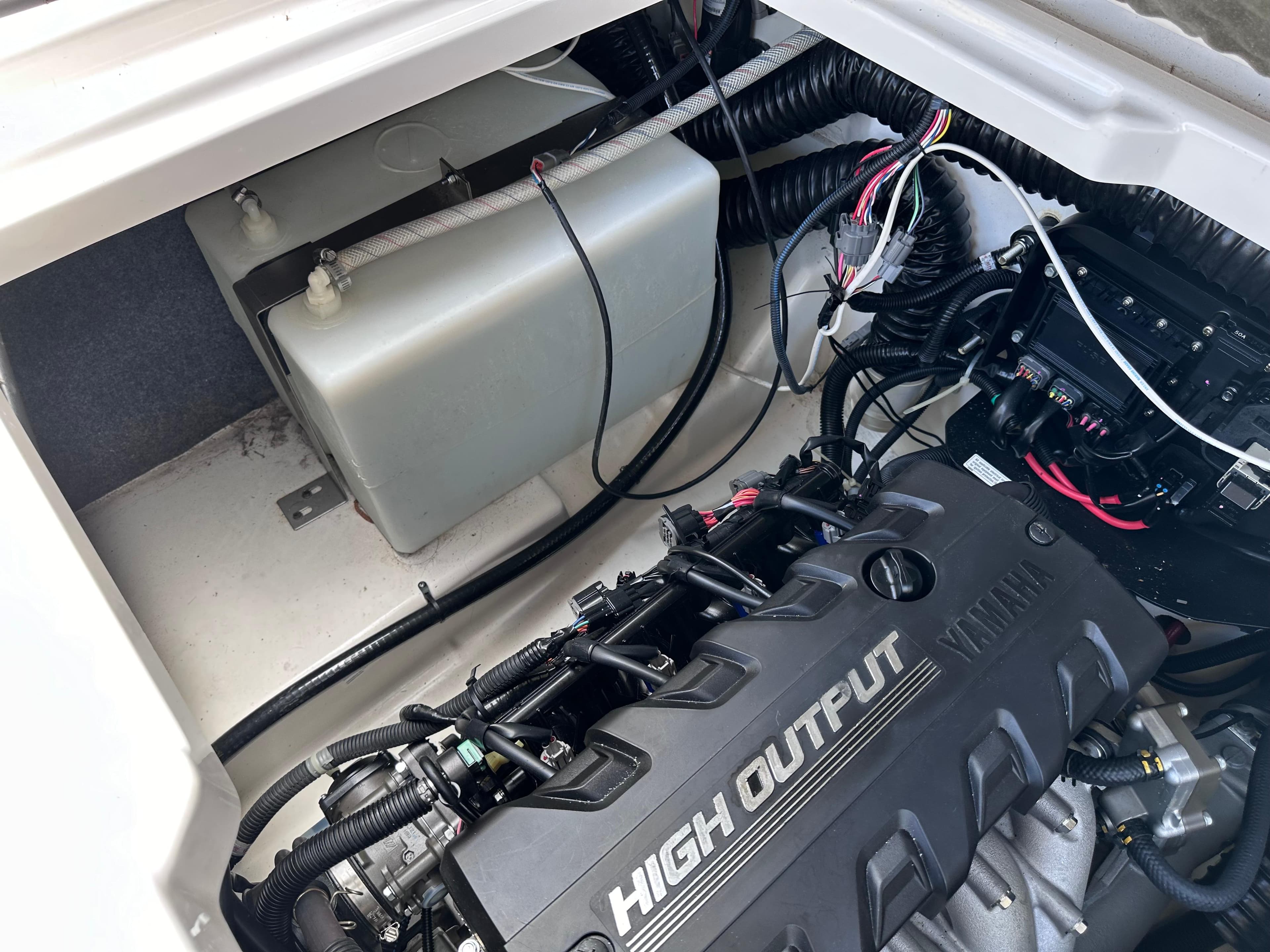 2021 Yamaha Boats 252 SD engine compartment with high output engine and wiring.