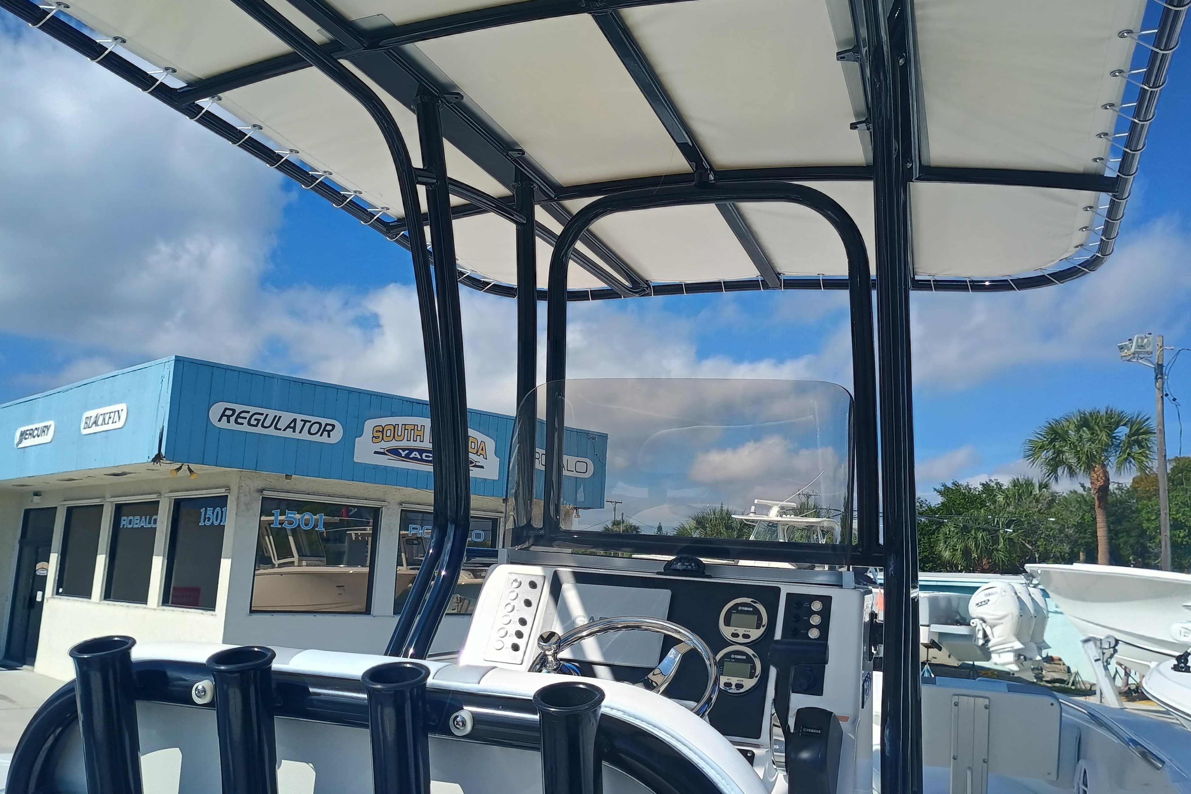 2026 Robalo R200 Center Console boat at dealership, clear sky background.