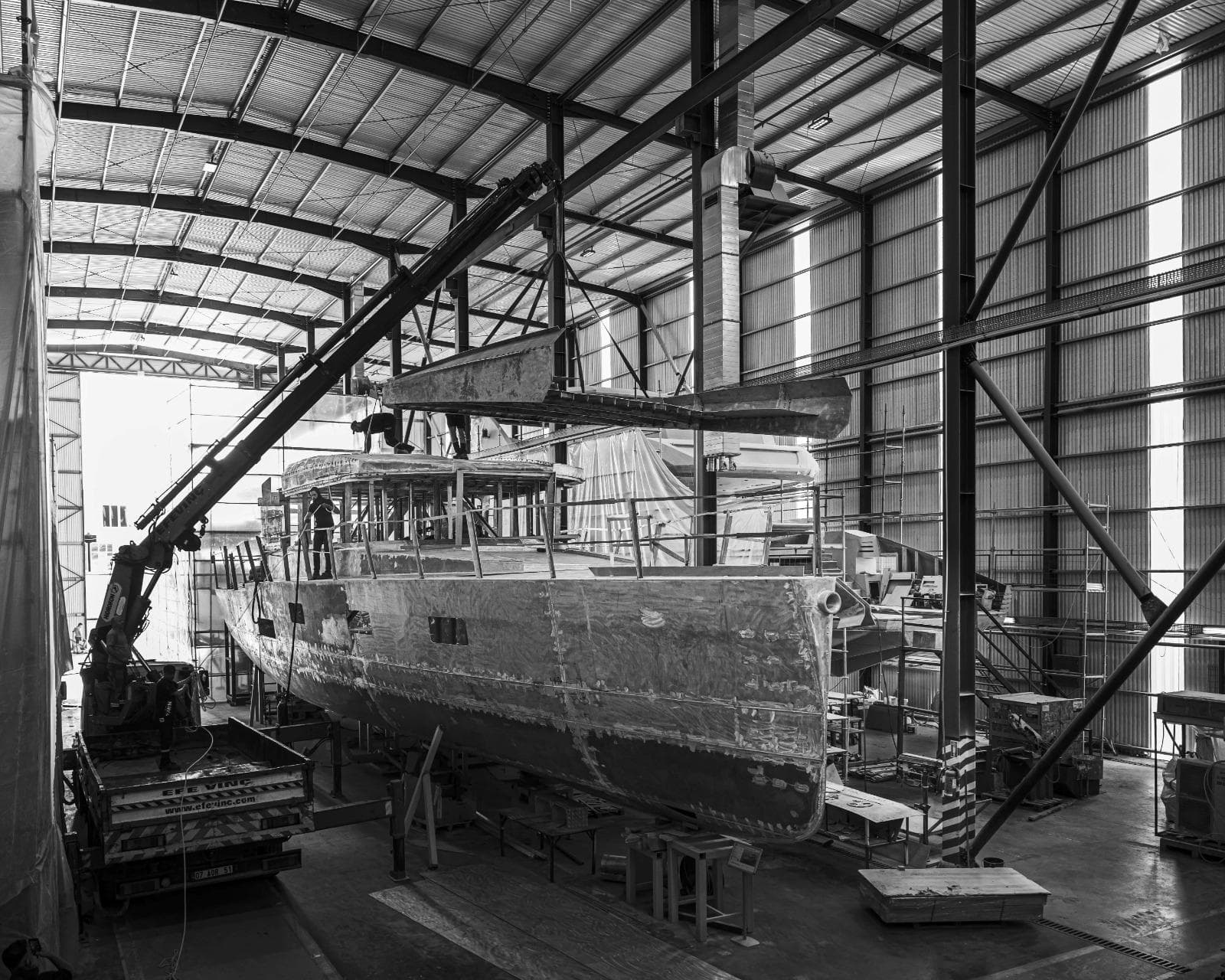 Naval Yachts XPM85 2024 model under construction in a shipyard.