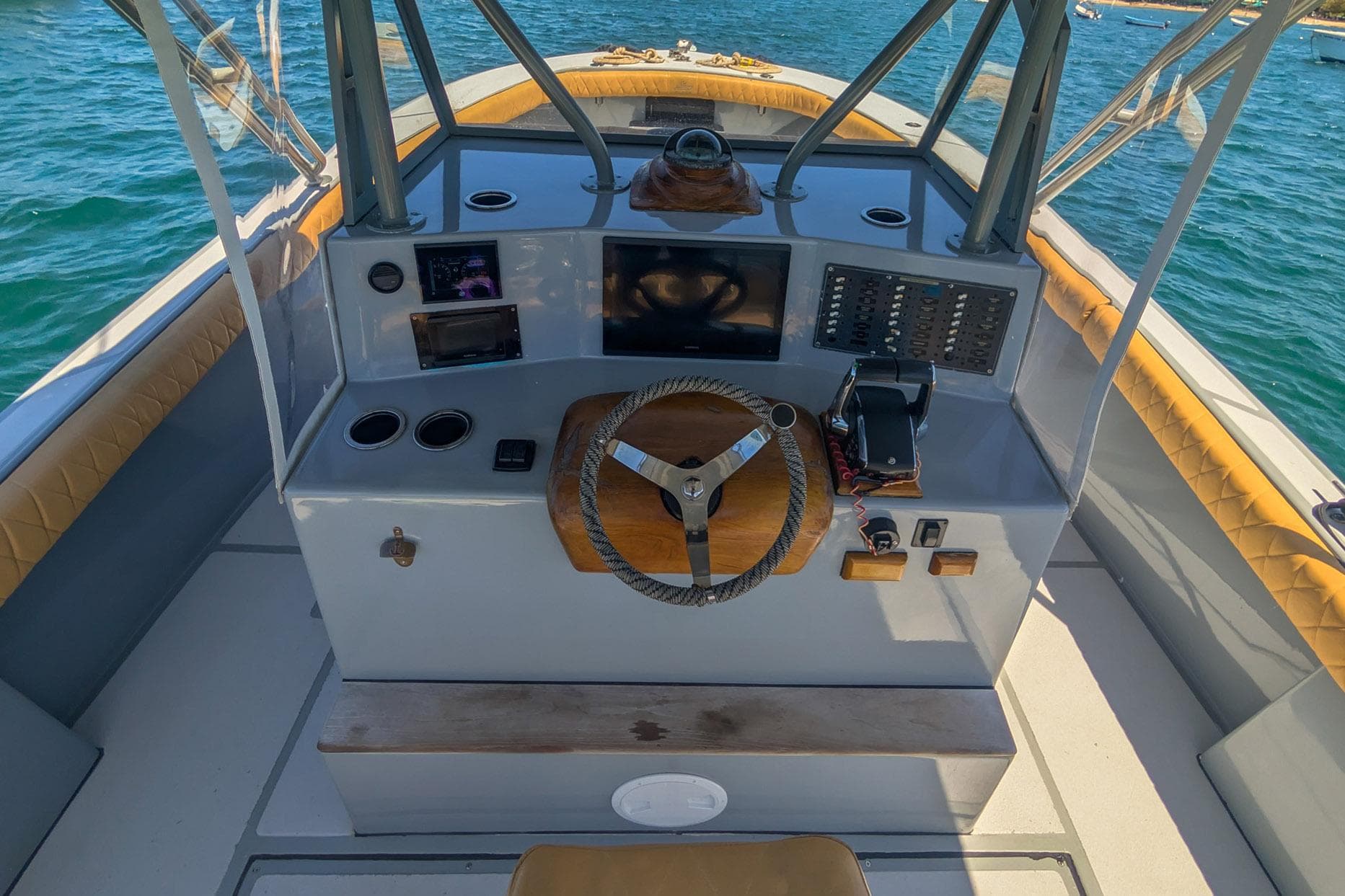 Cockpit of a 1995 Ocean Master 34 boat with steering wheel and control panel.