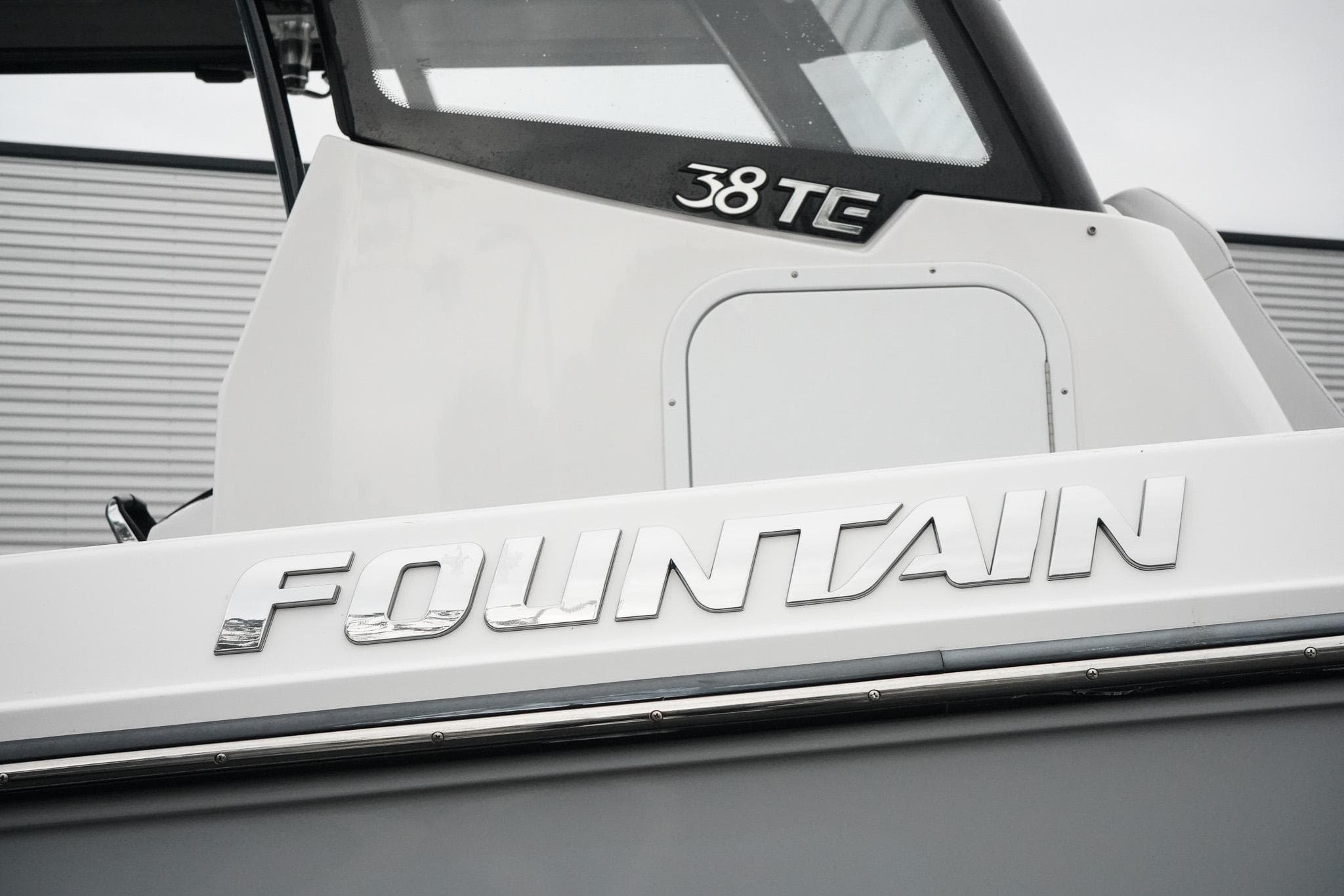 2023 Fountain Bluewater 38 Tournament Edition boat, close-up of logo and model name.