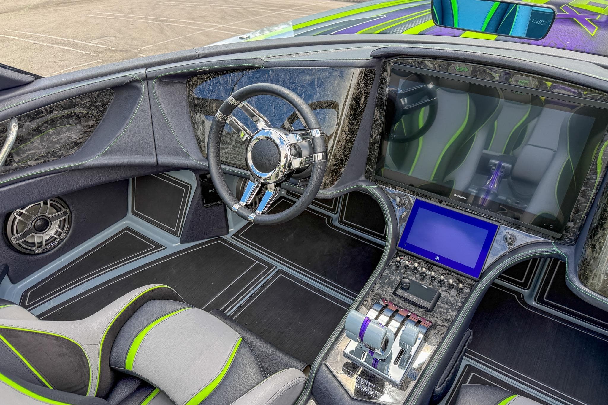 2024 MTI 440X boat interior with modern steering wheel and advanced control panel.
