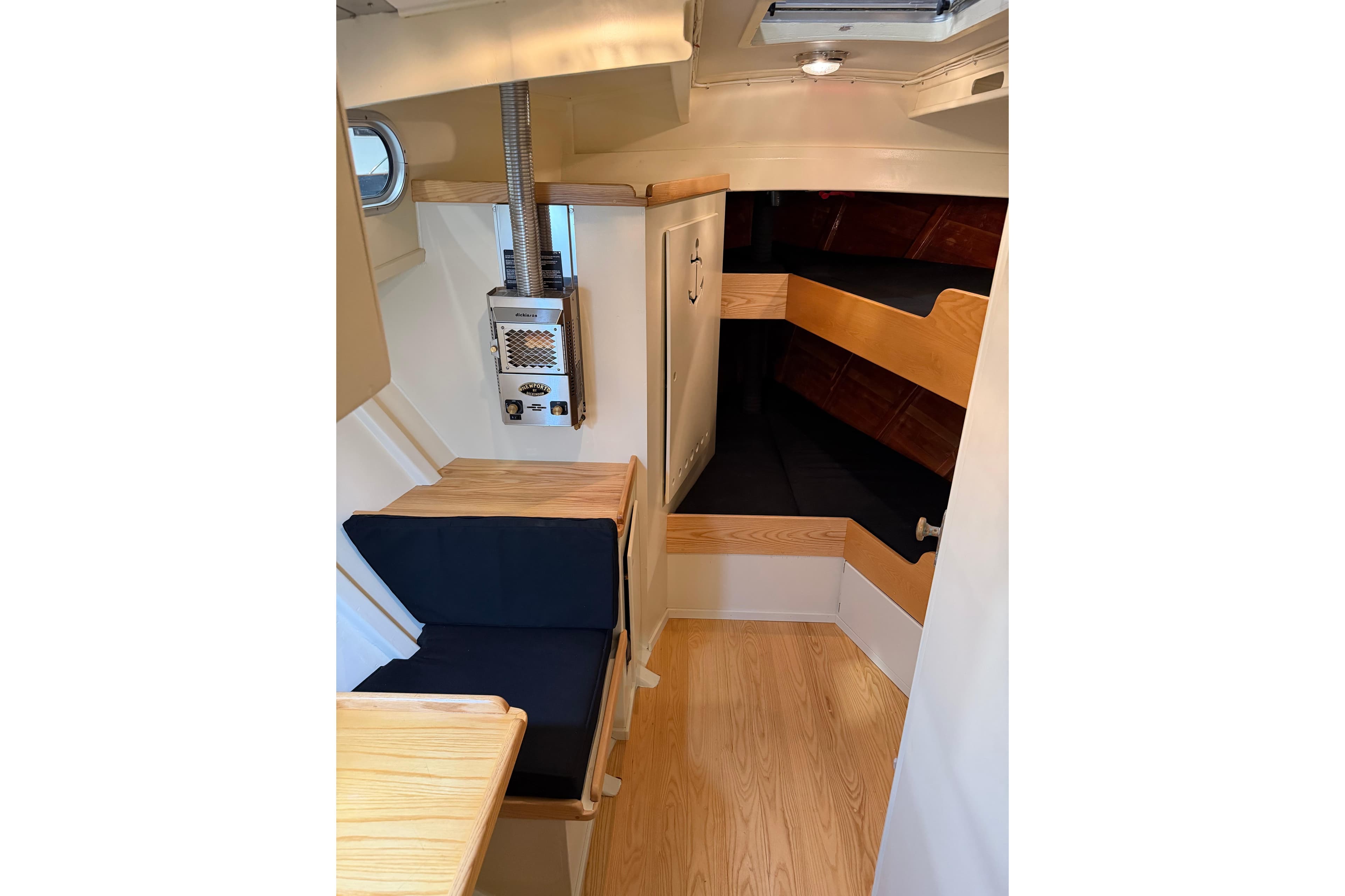 2022 Covey Island 38 Lobster Yacht interior with wood finish and seating area.