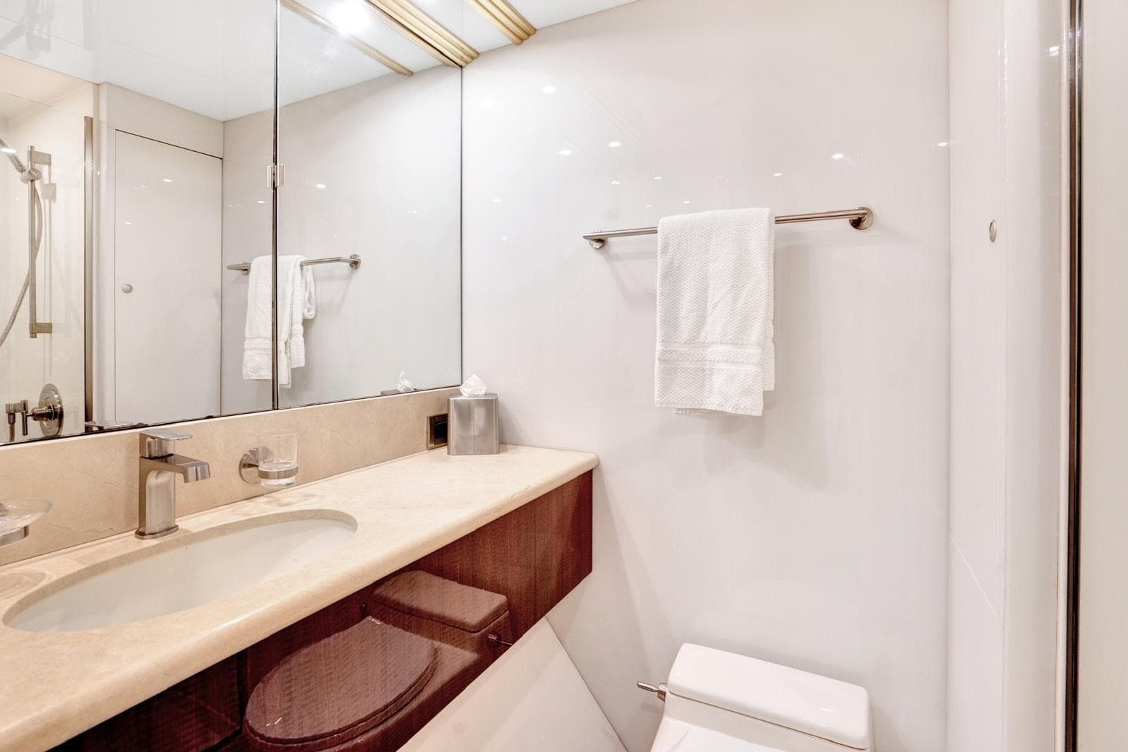 Luxurious bathroom in 2001 Lazzara Motoryacht with elegant fixtures and modern design.
