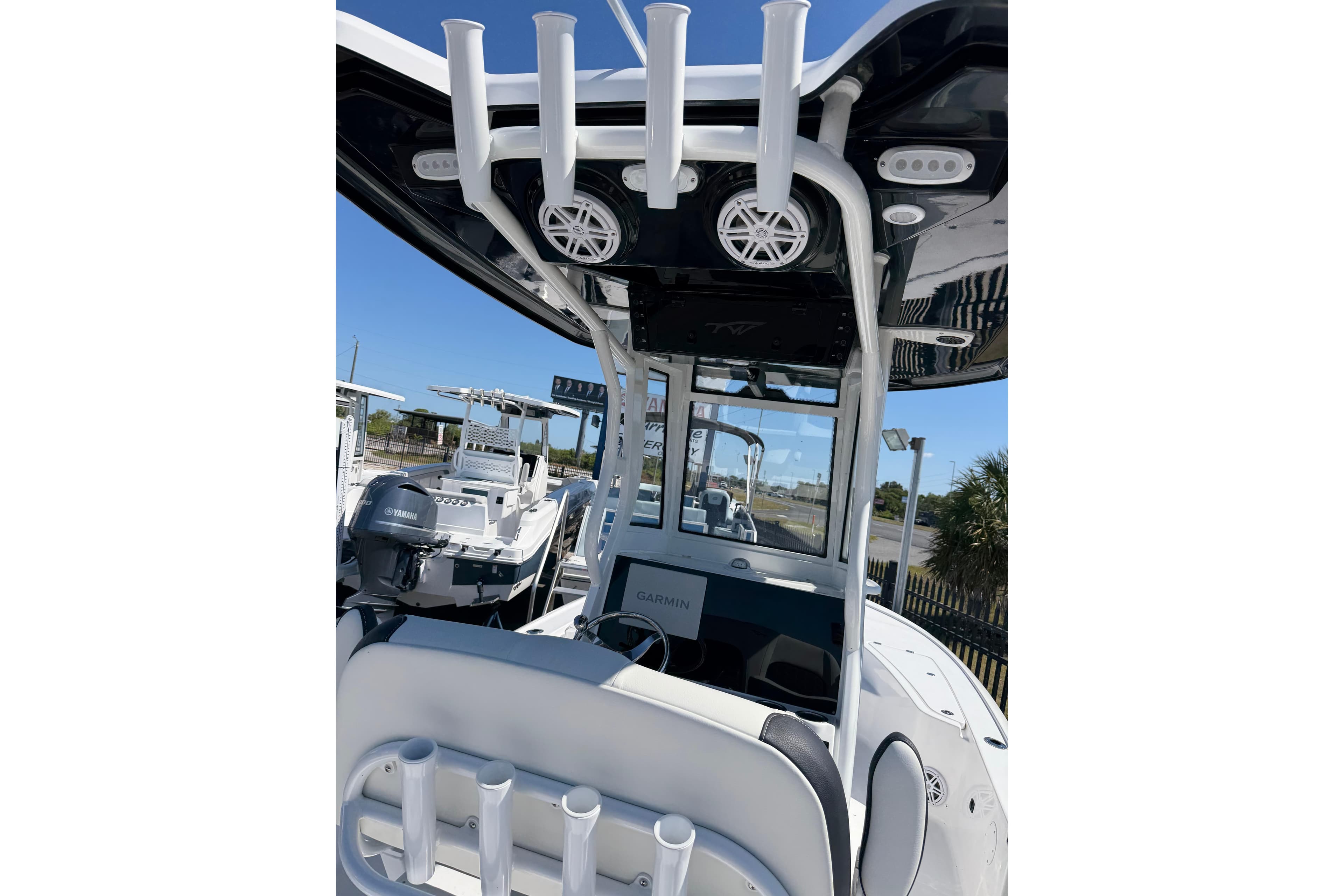 2026 Tidewater 2410 Bay Max boat interior with rod holders and Garmin electronics.