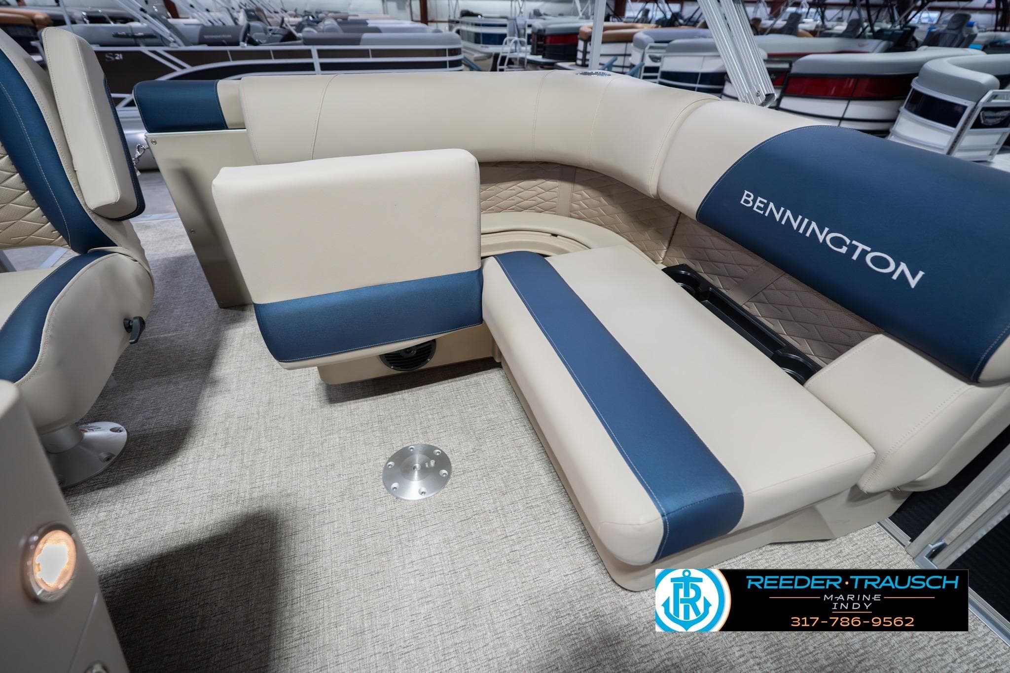 2026 Bennington 168 SLJ boat interior with blue and beige seating, Reeder-Trausch Marine logo.