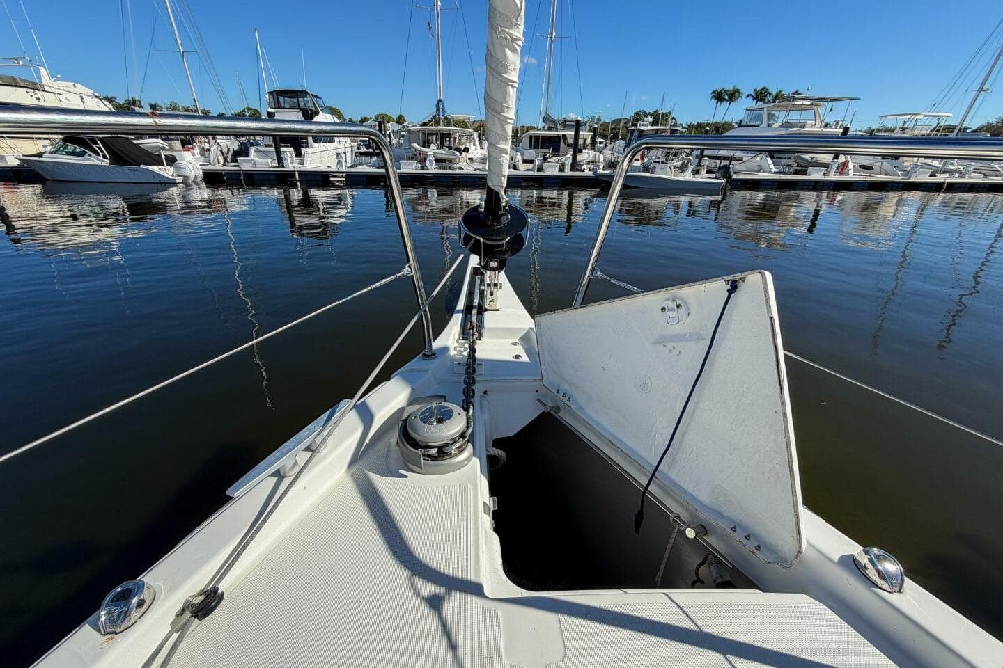 Beneteau Oceanis 40.1 sailboat bow at marina, 2022 model, sunny day.