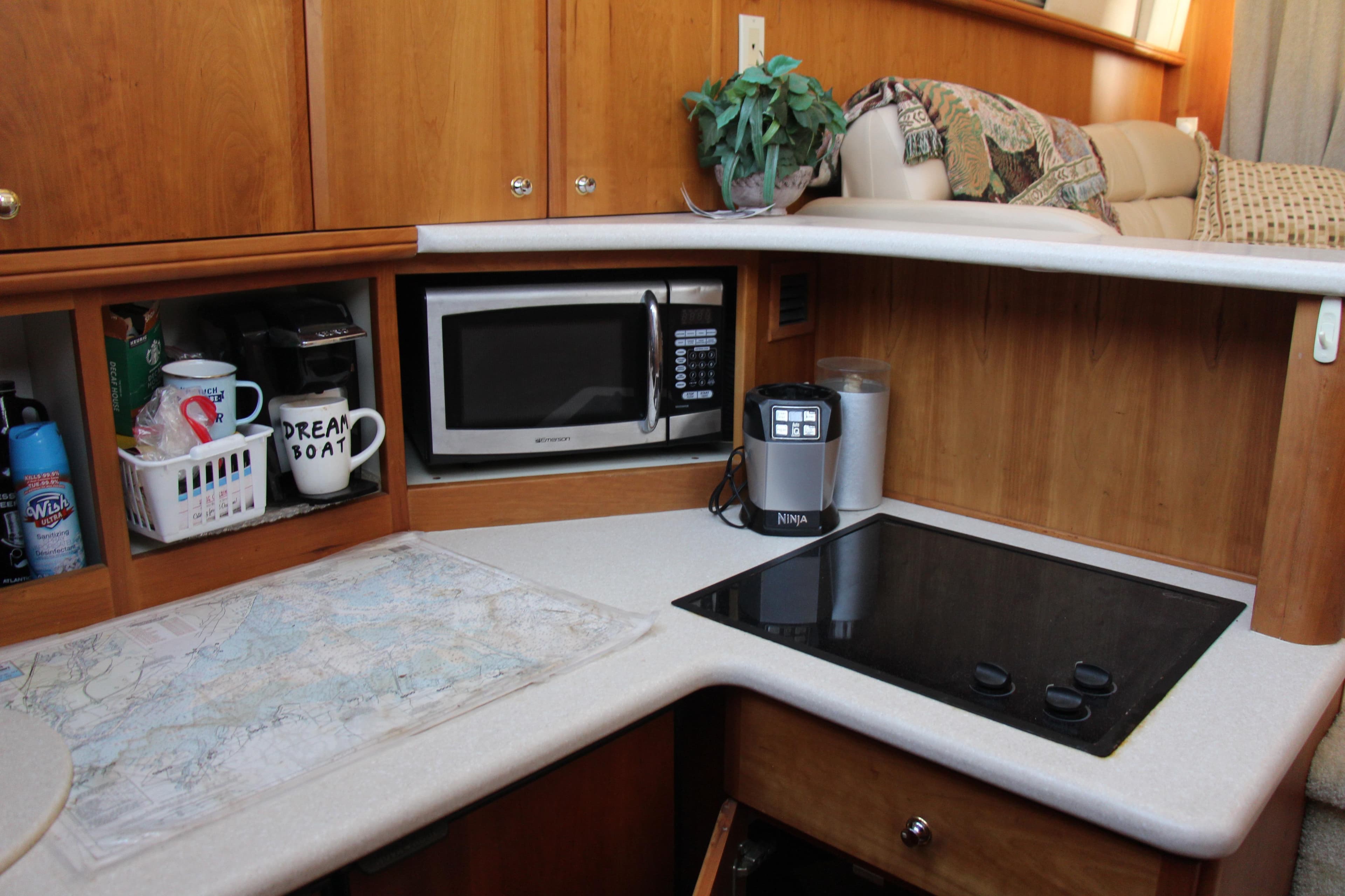 2003 Silverton 38 Convertible kitchen with microwave, stove, and coffee maker.