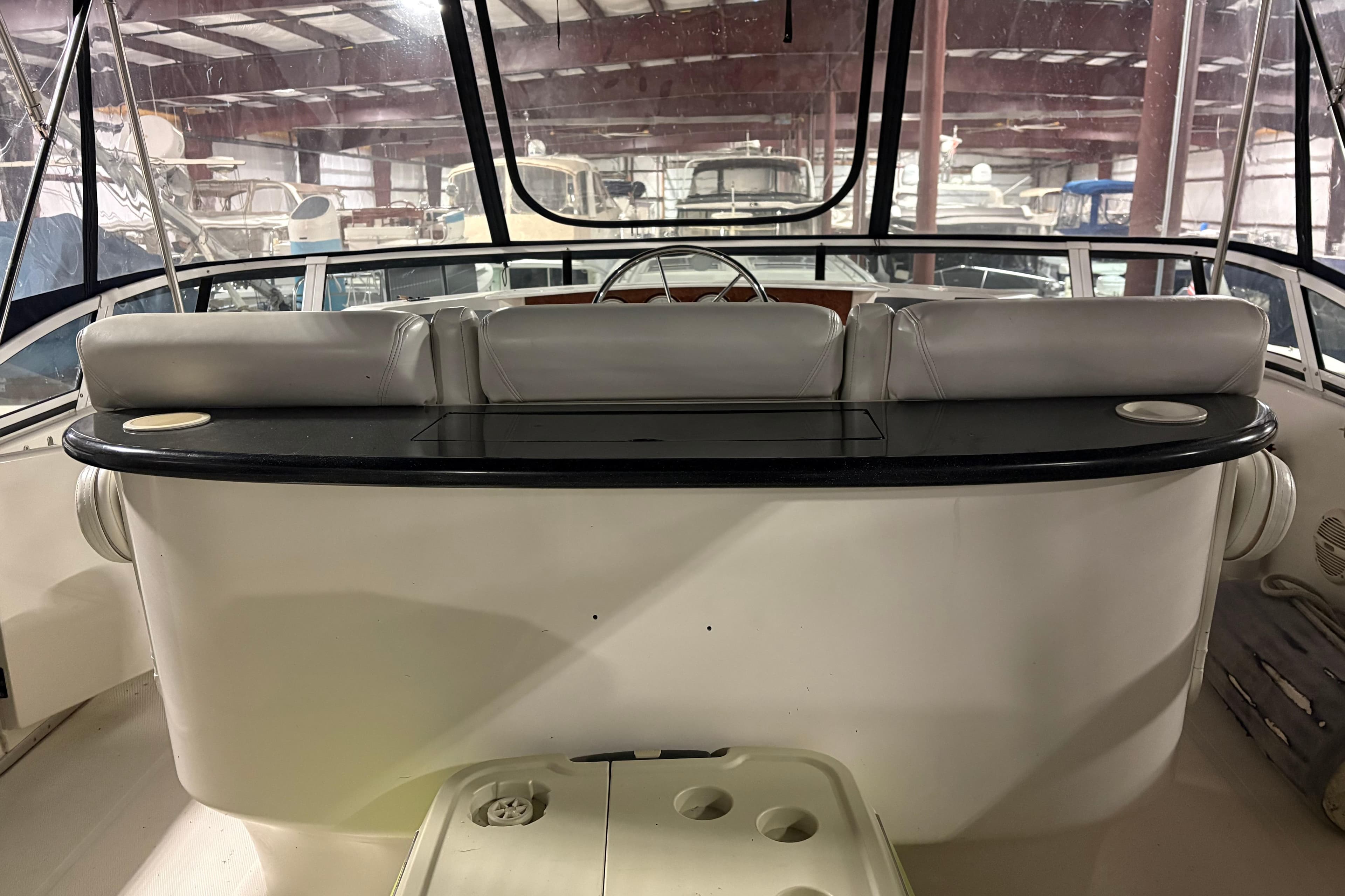 2003 Silverton 43 Motor Yacht interior with helm and seating area.