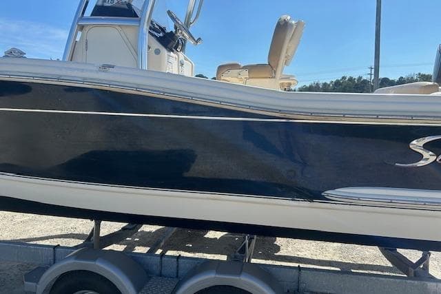 2022 Scout 215 XSF boat on trailer, side view with sleek design.