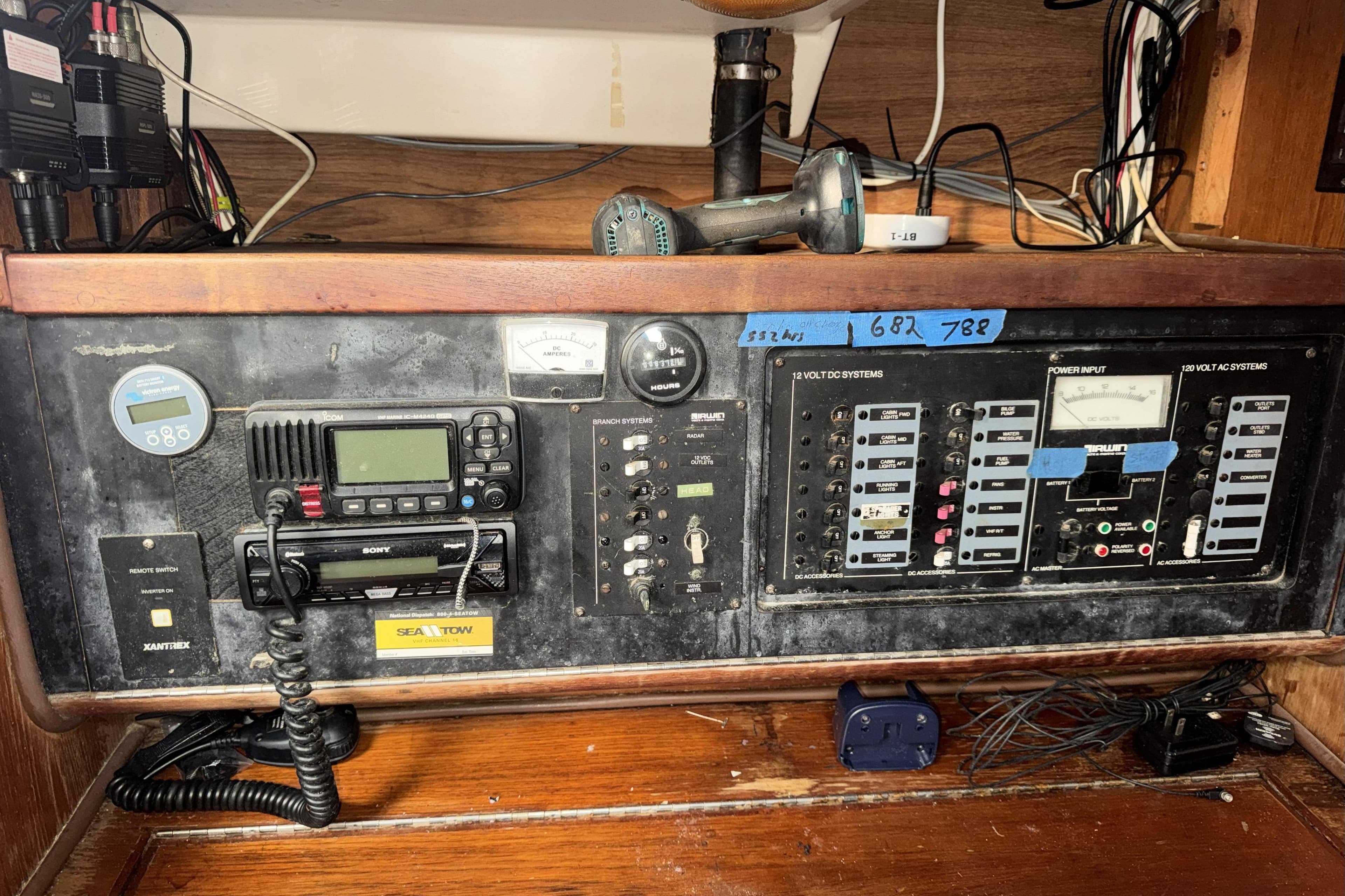 Electrical control panel on a 1987 Irwin 38 sailboat, featuring various switches and meters.