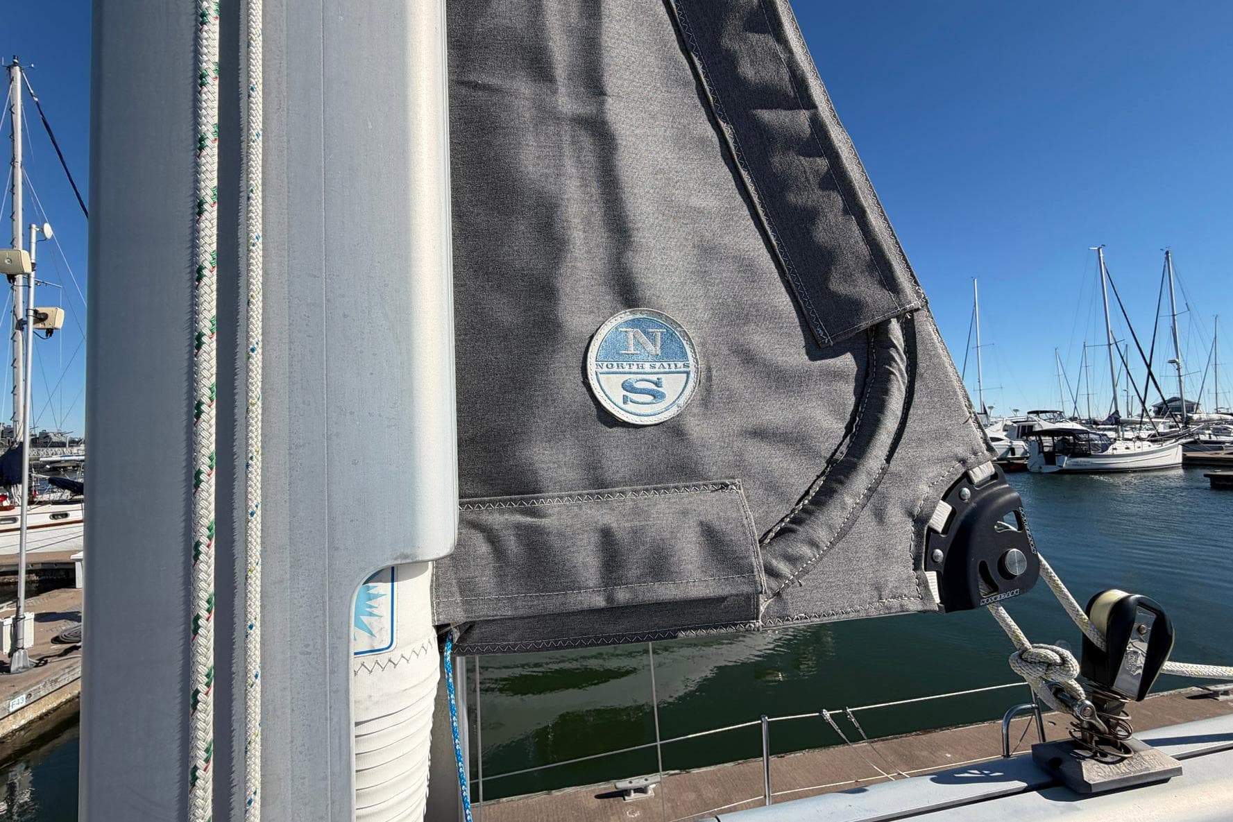 Close-up of a 2001 Catalina 36 MkII sailboat mast and sail in a marina.