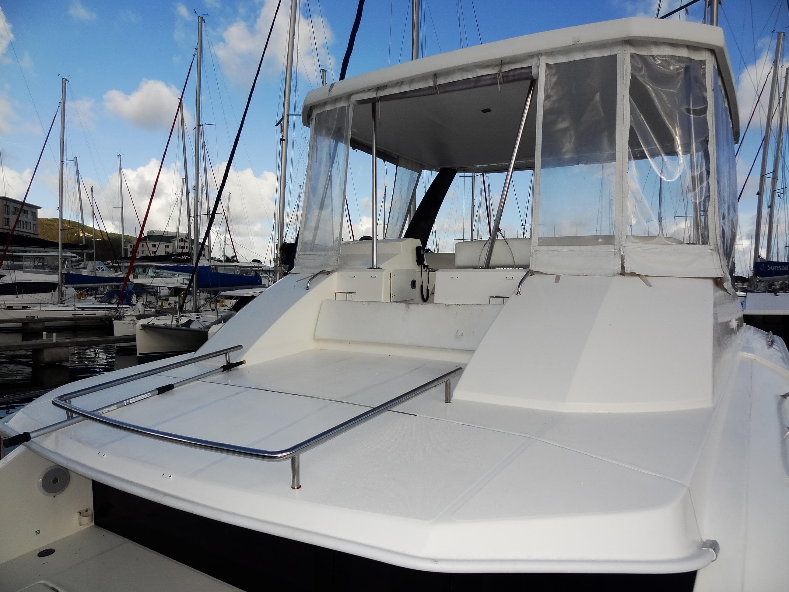 2018 Leopard 43 Powercat yacht docked at marina with clear skies.