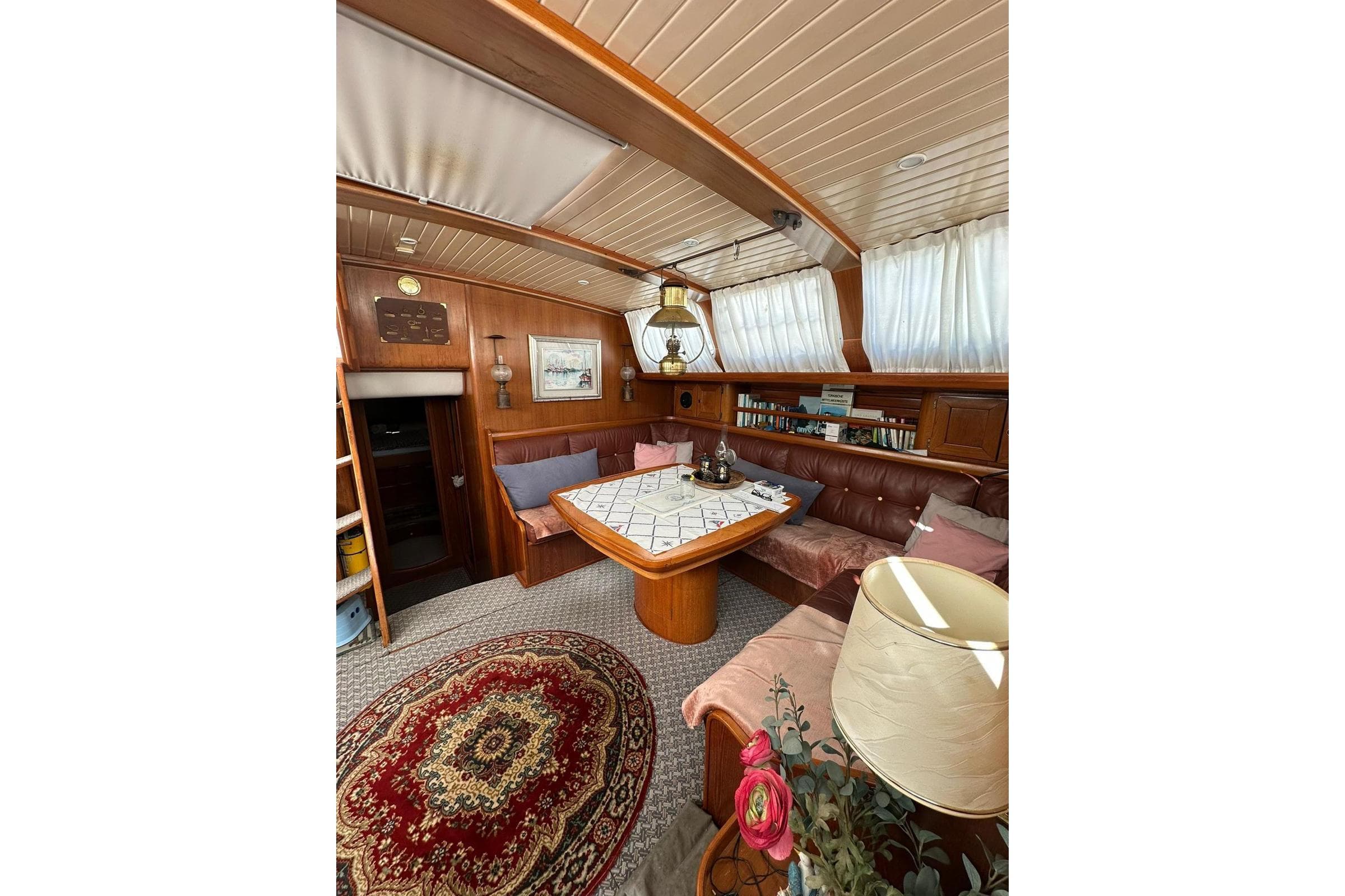 Cozy interior of 1989 North Wind 56 yacht with wood paneling and elegant decor.