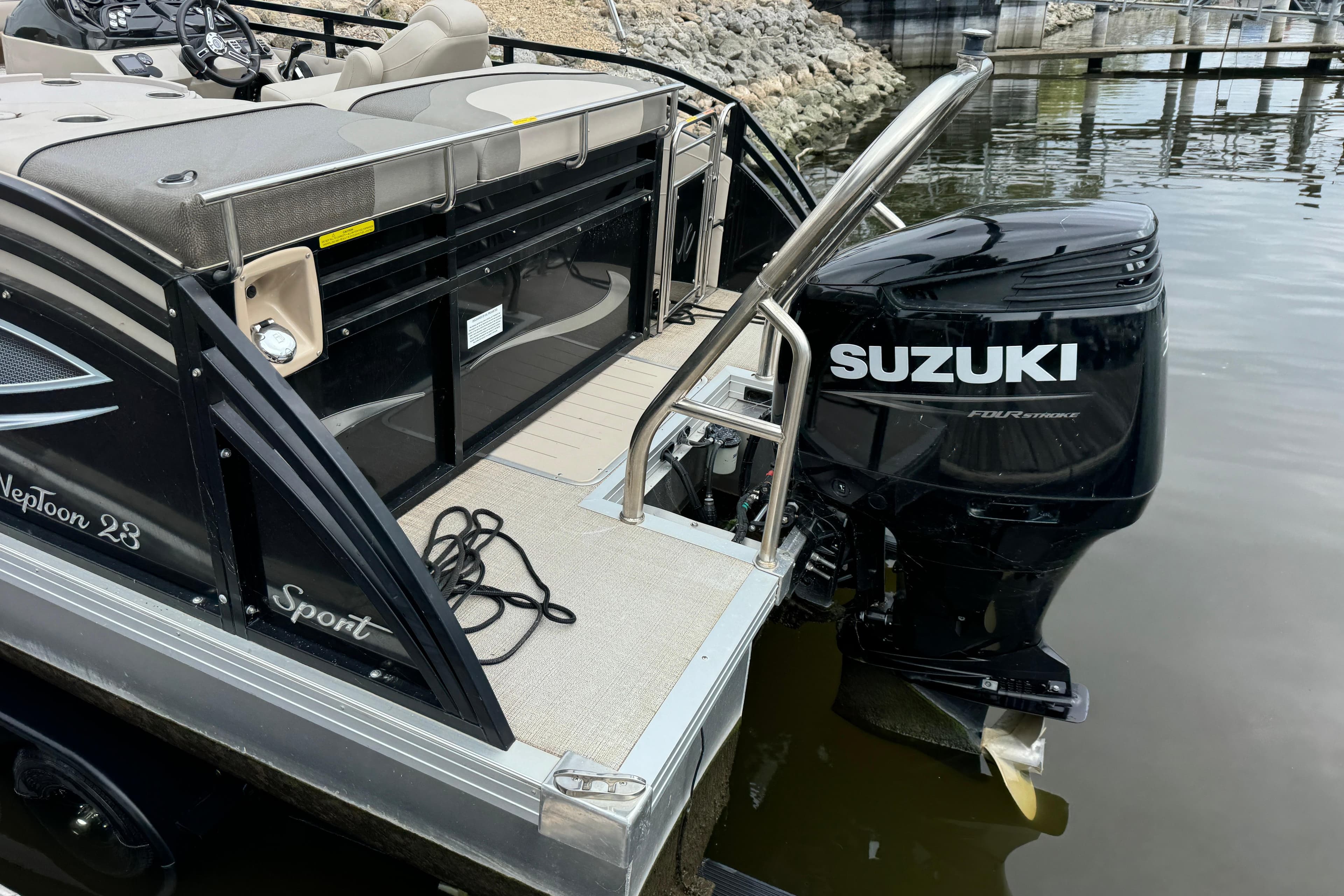2017 JC 23 Neptoon TT Sport pontoon boat with Suzuki outboard motor.