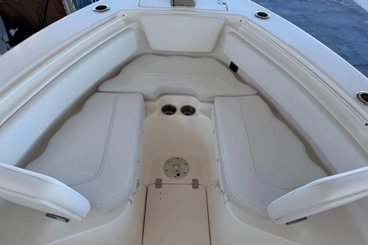 2026 Key West 239 FSR boat interior with white cushioned seating.