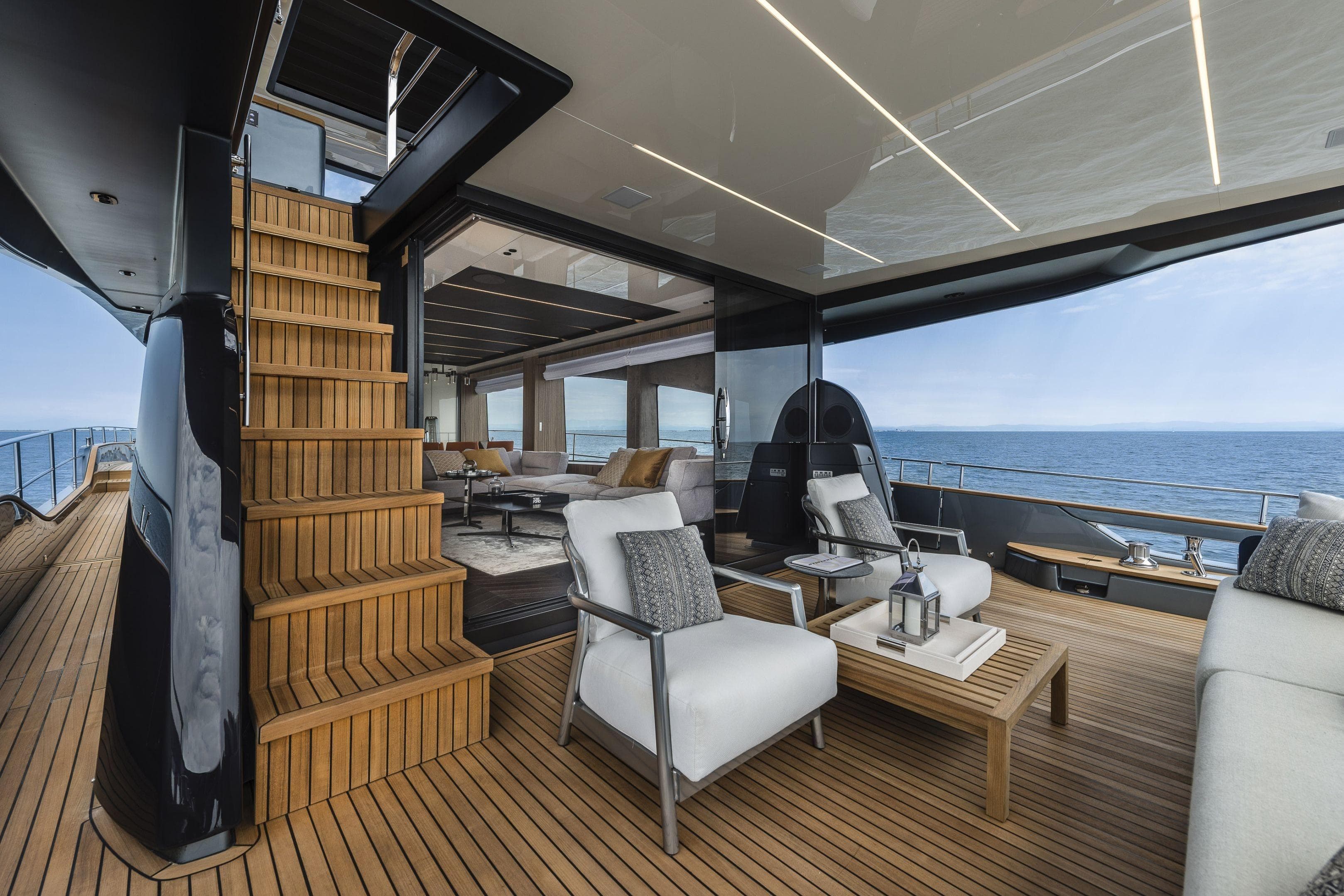 Luxurious 2026 Cranchi Settantotto 78 yacht interior with elegant seating and ocean view.