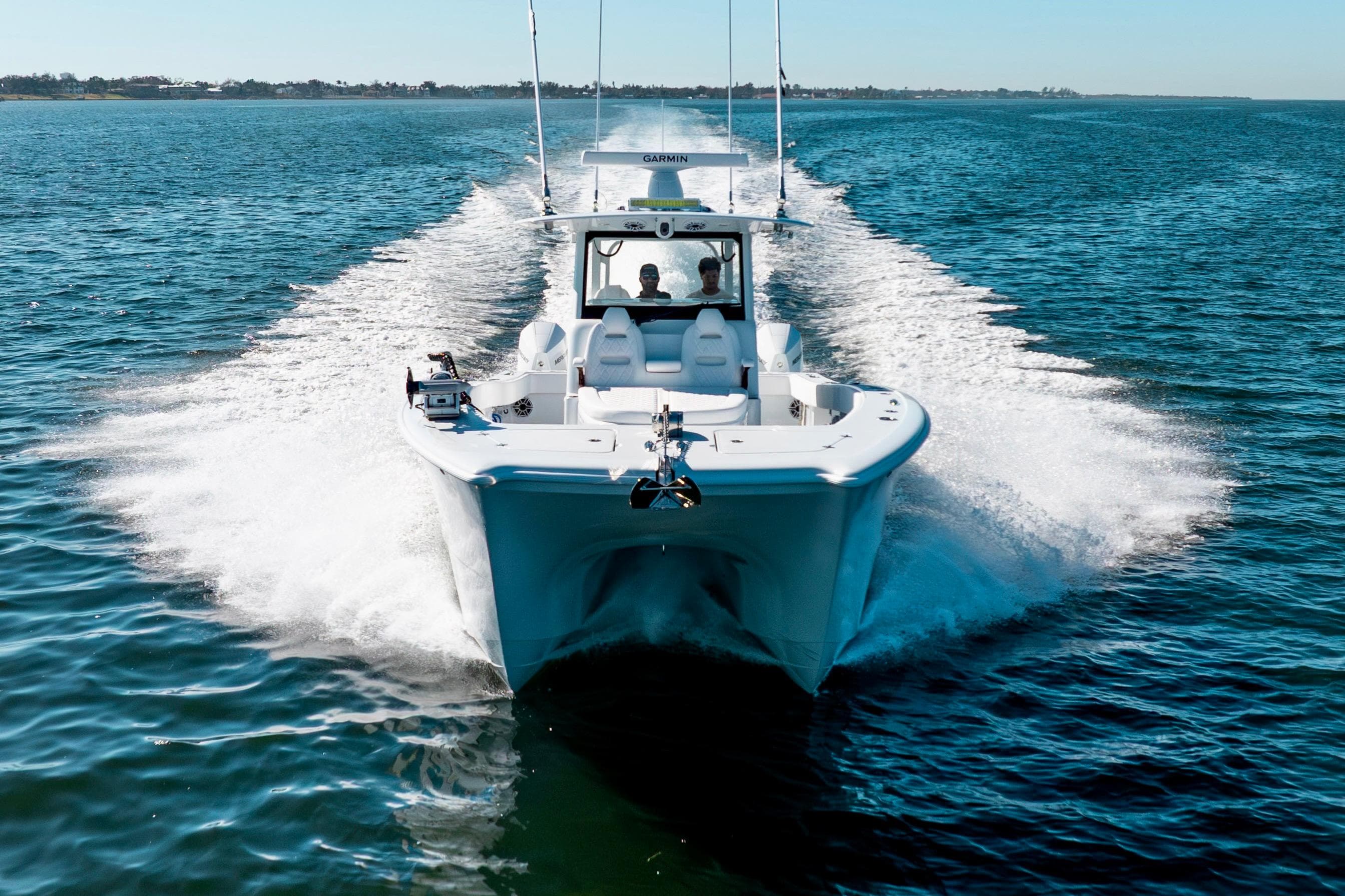 2026 Freeman 35 boat cruising on open water, creating a dynamic wake.