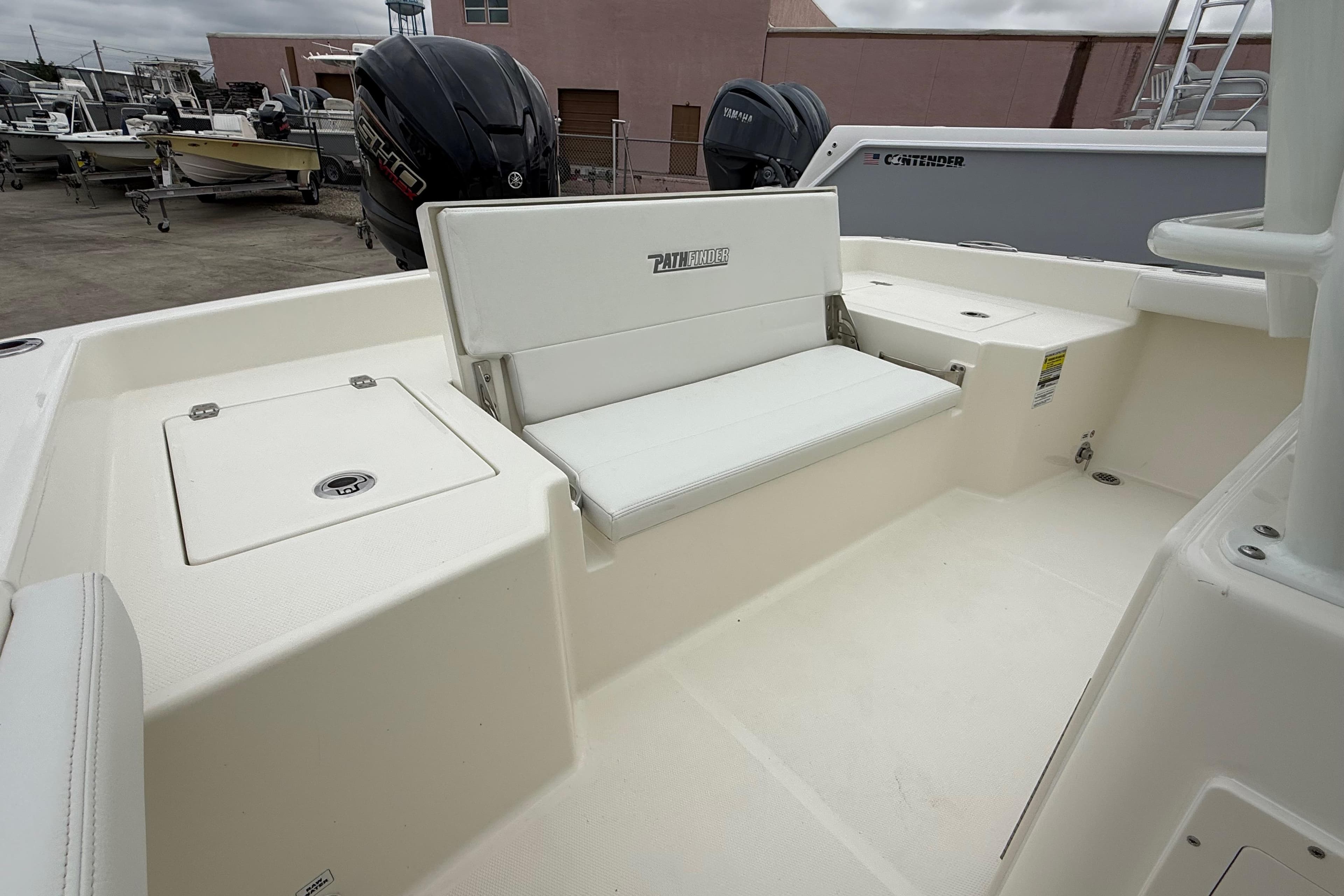 2026 Pathfinder 2400 TRS boat interior with seating and storage compartments.