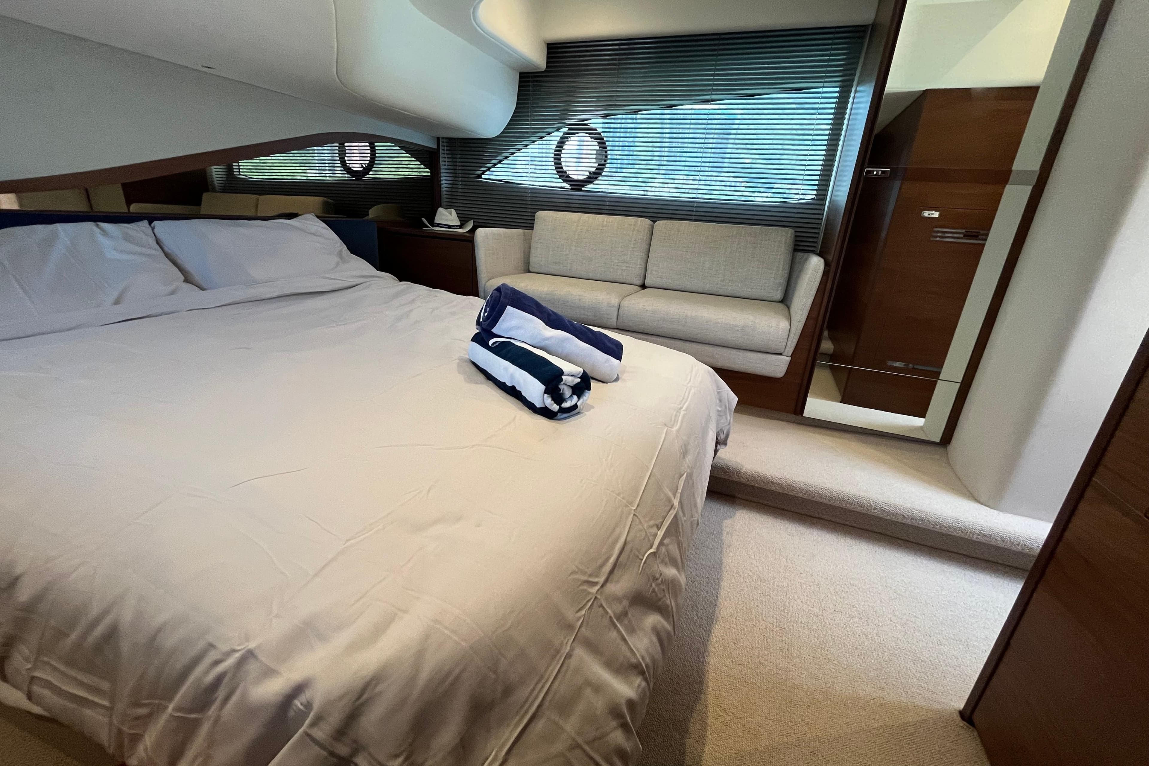 Luxurious bedroom interior of 2020 Princess 45 Flybridge Motor Yacht.