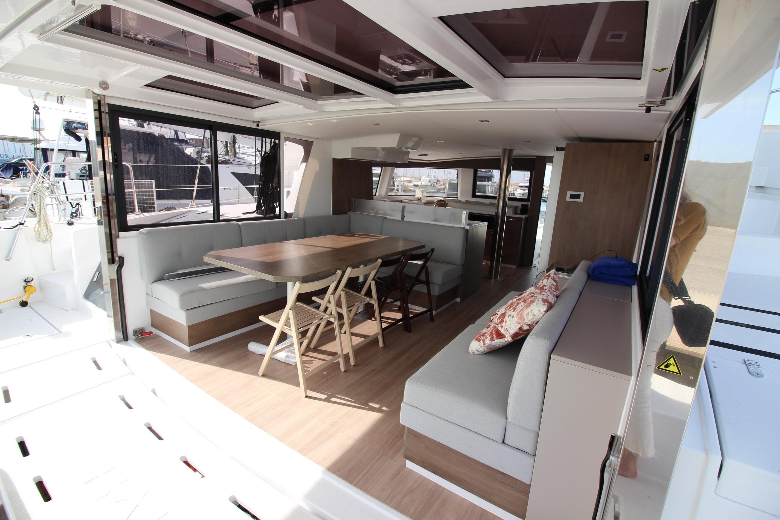 Luxurious interior of 2022 Bali 4.6 yacht with spacious seating and dining area.