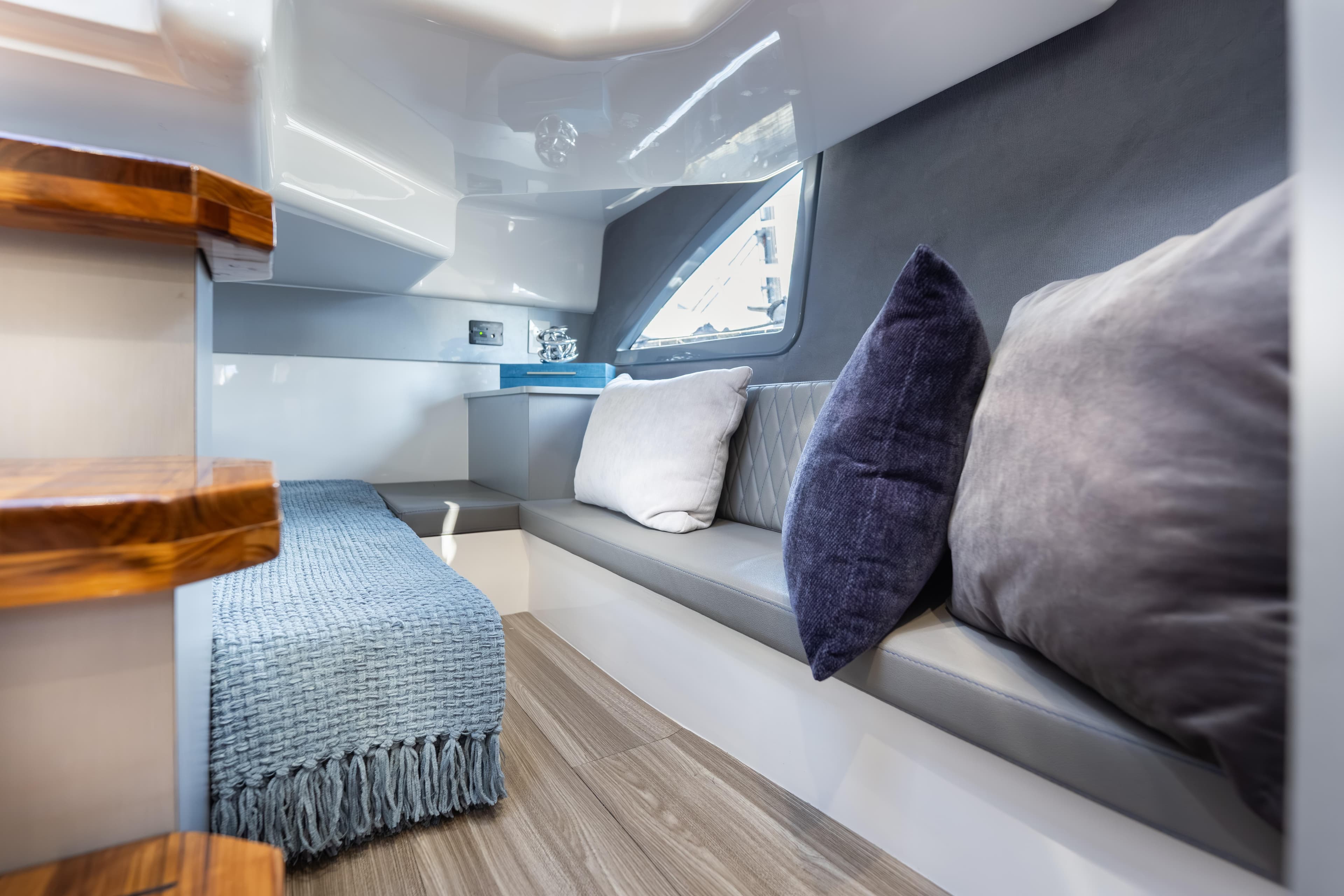 Luxurious interior of 2026 Hanover 347 yacht with cozy seating and elegant decor.