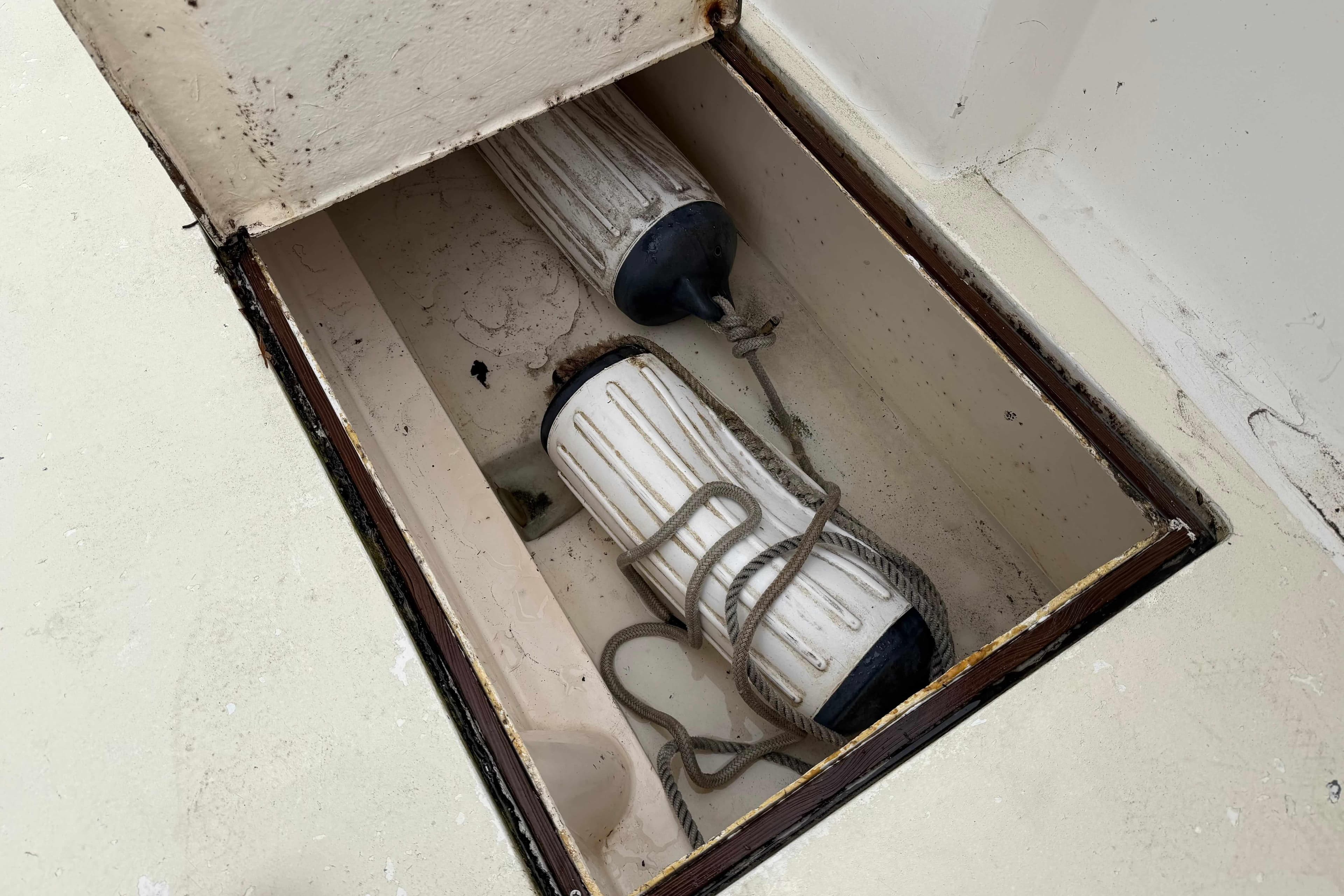 Storage compartment with boat fenders on 1986 Henriques Yachts 35 Maine Coaster.