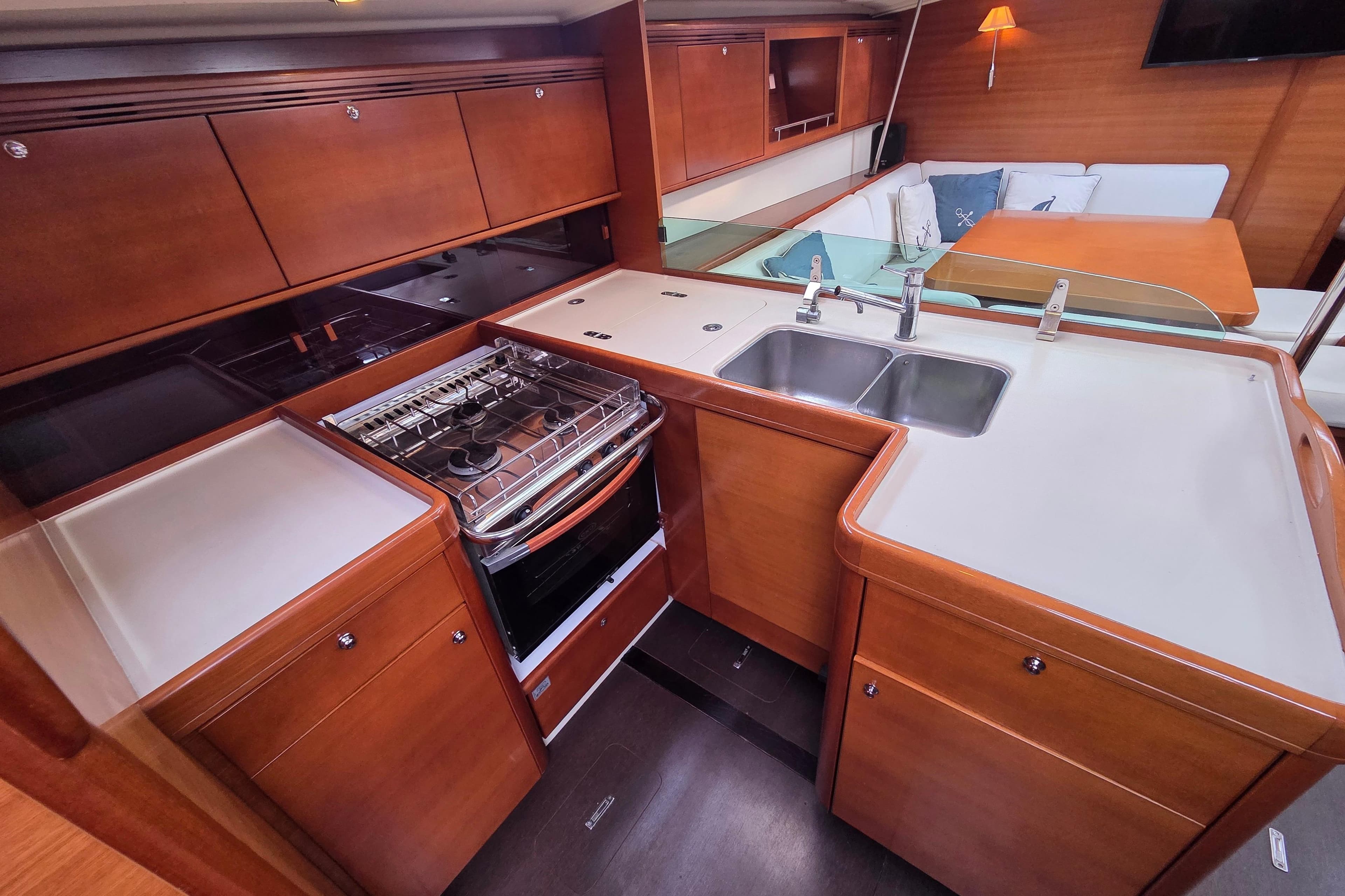 Luxurious 2009 Dufour 485 Grand Large yacht interior with modern kitchen and seating area.