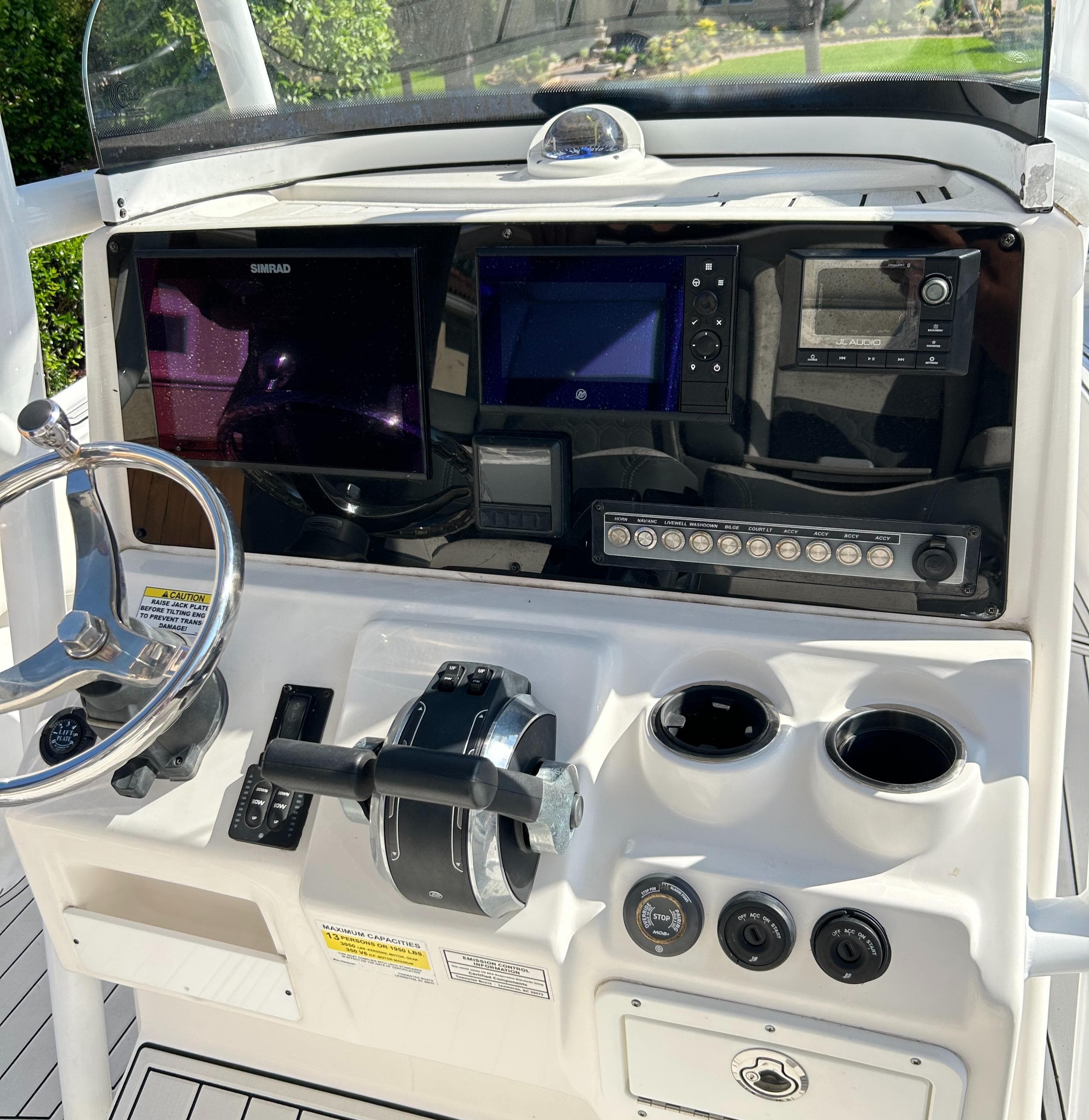 Helm of 2018 Tidewater 2700 Carolina Bay boat with navigation controls and displays.