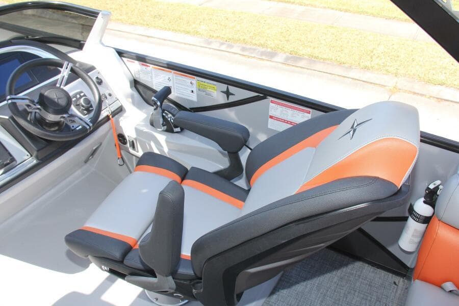 Captain's seat of 2021 Berkshire 25 Sport CL boat, featuring modern controls and stylish design.