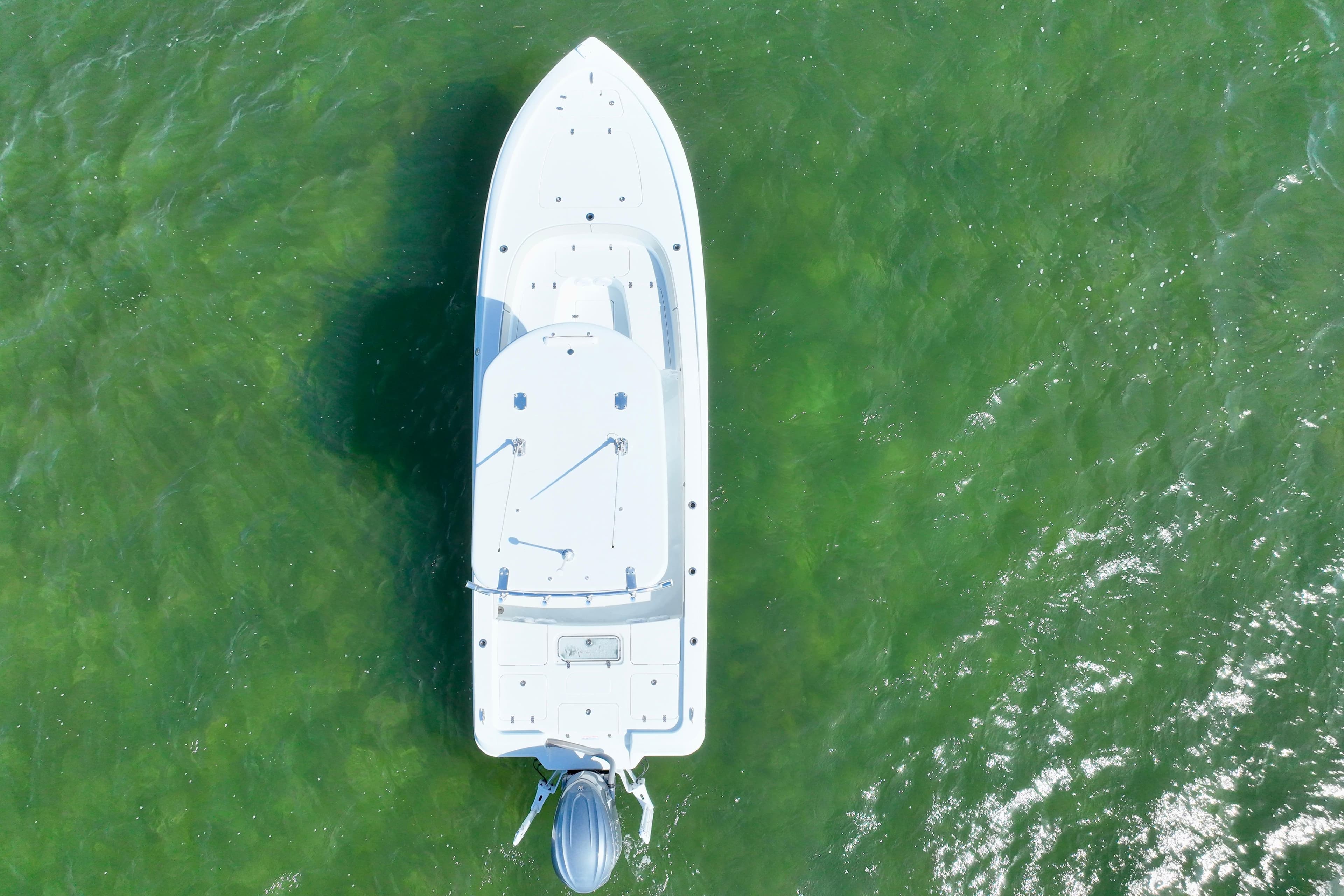 Aerial view of 2025 Contender 26 Bay boat on green water.